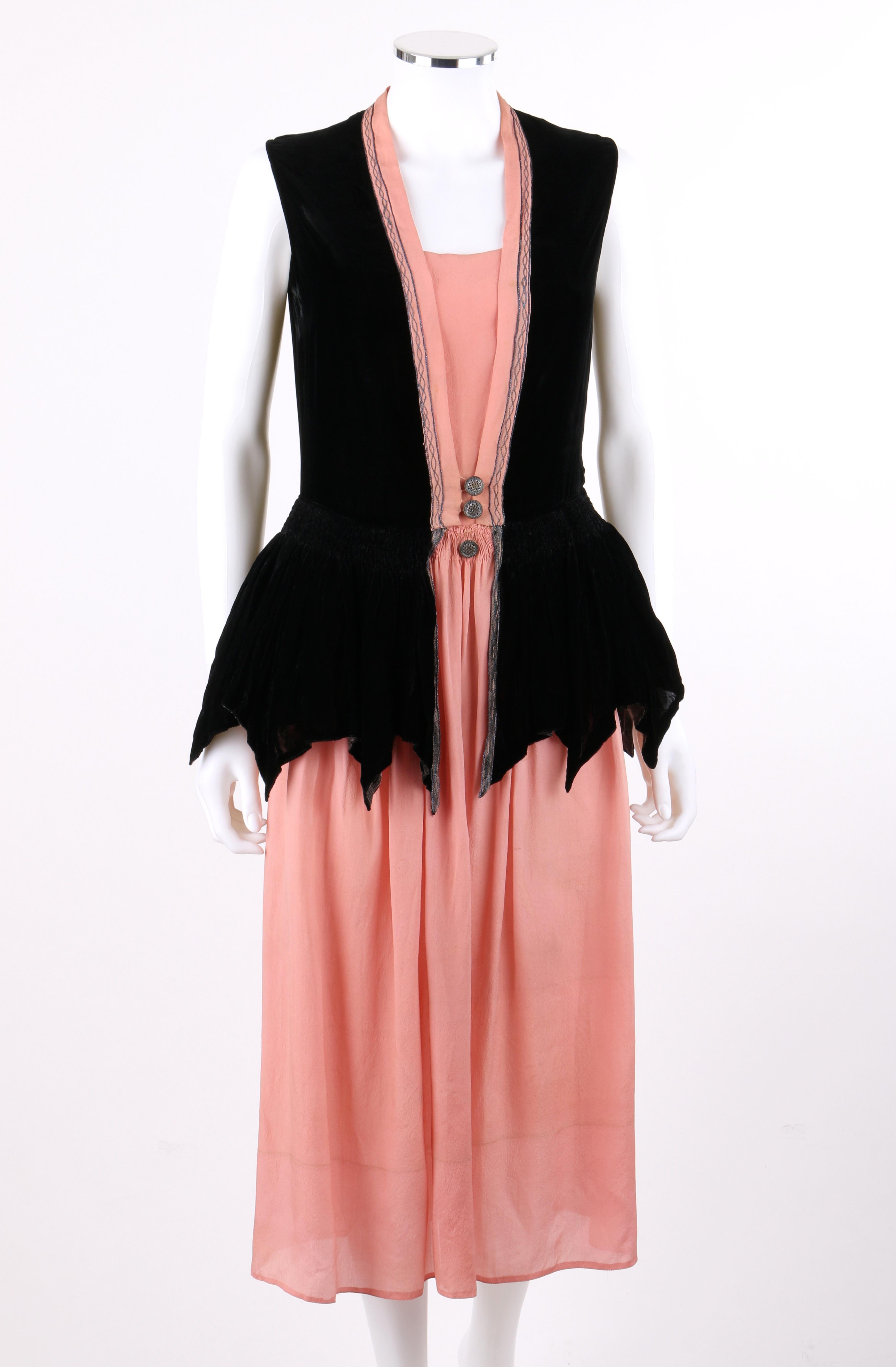 DESCRIPTION: BARNETT c.1910's Rose Pink & Black Silk Velvet Sleeveless Peplum Evening Dress 
 
Circa: c.1910's Edwardian / 1920's Flapper
Label(s): Barnett 
Style: Peplum dress
Color(s): Rose pink, black, and metallic blue
Lined: No
Unmarked Fabric