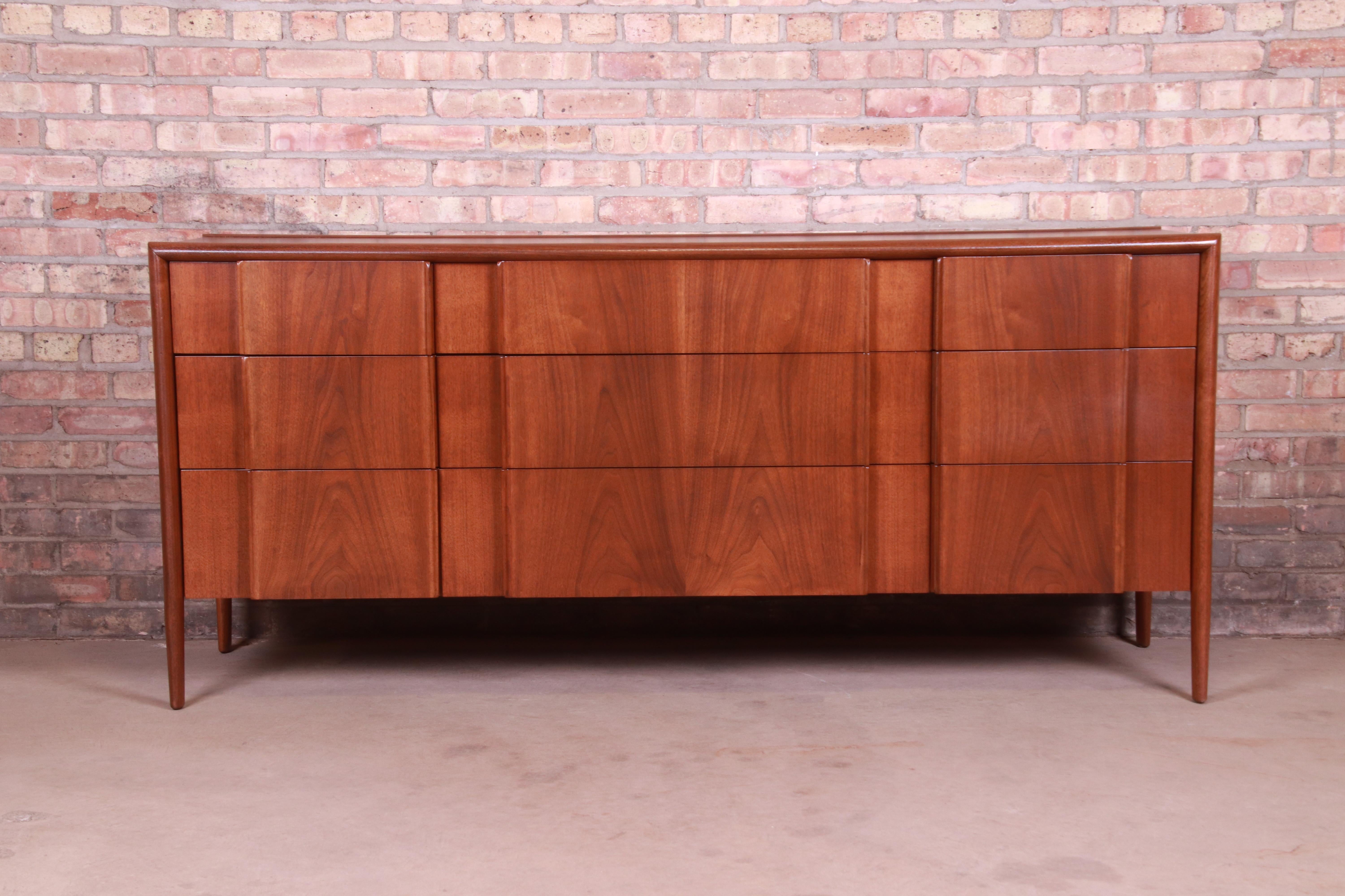 A gorgeous Mid-Century Modern sculpted walnut long dresser or credenza

By Barney Flagg for Drexel Furniture 