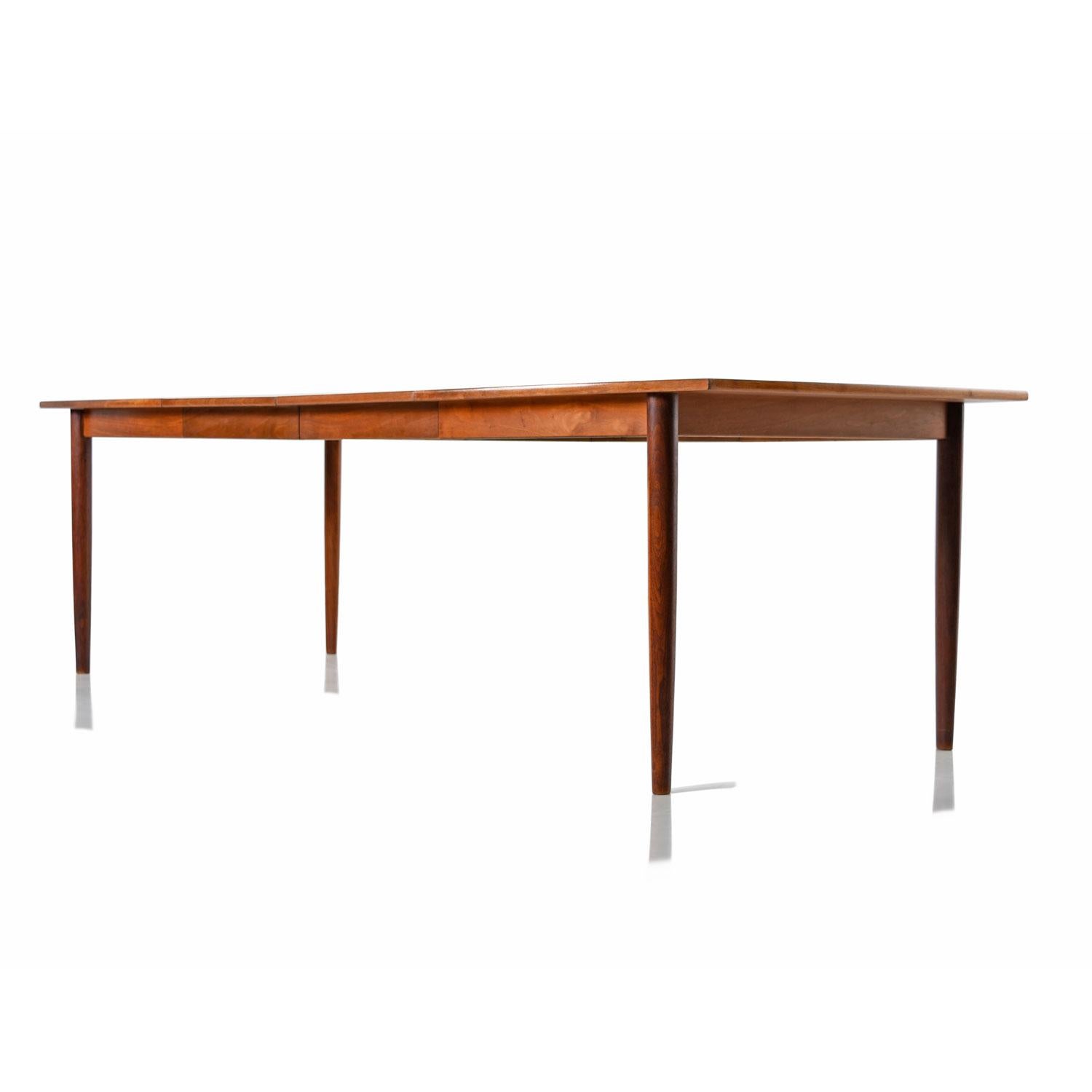 Designed by Barney Flagg in the 1960’s, this Drexel Parallel dining table seems to be inspired by both Scandinavian and Italian modern design. Take note of the subtle Danish style bow that arcs out towards the center of the table. A classic modern