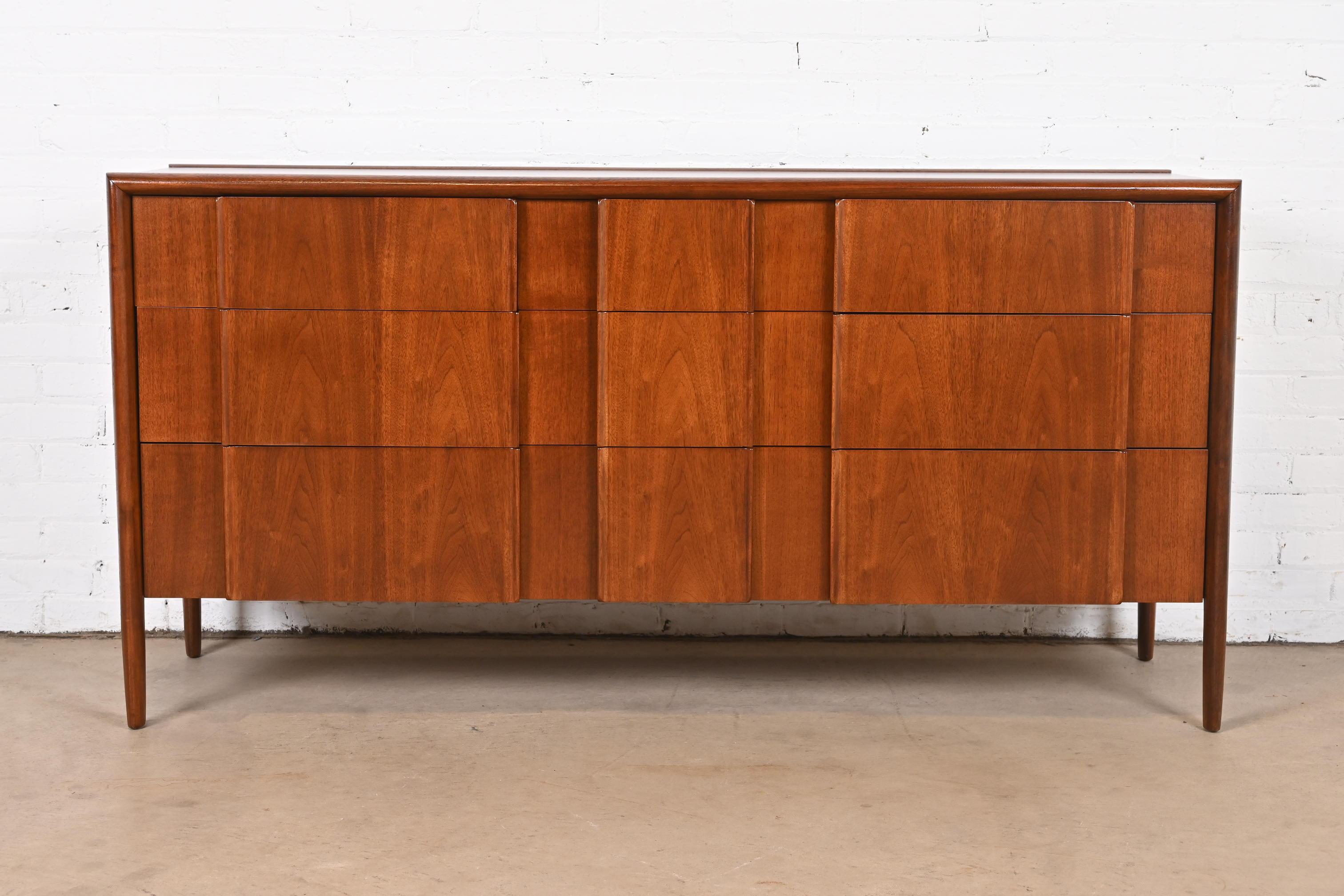A gorgeous Mid-Century Modern sculpted walnut long dresser or credenza

By Barney Flagg for Drexel, 