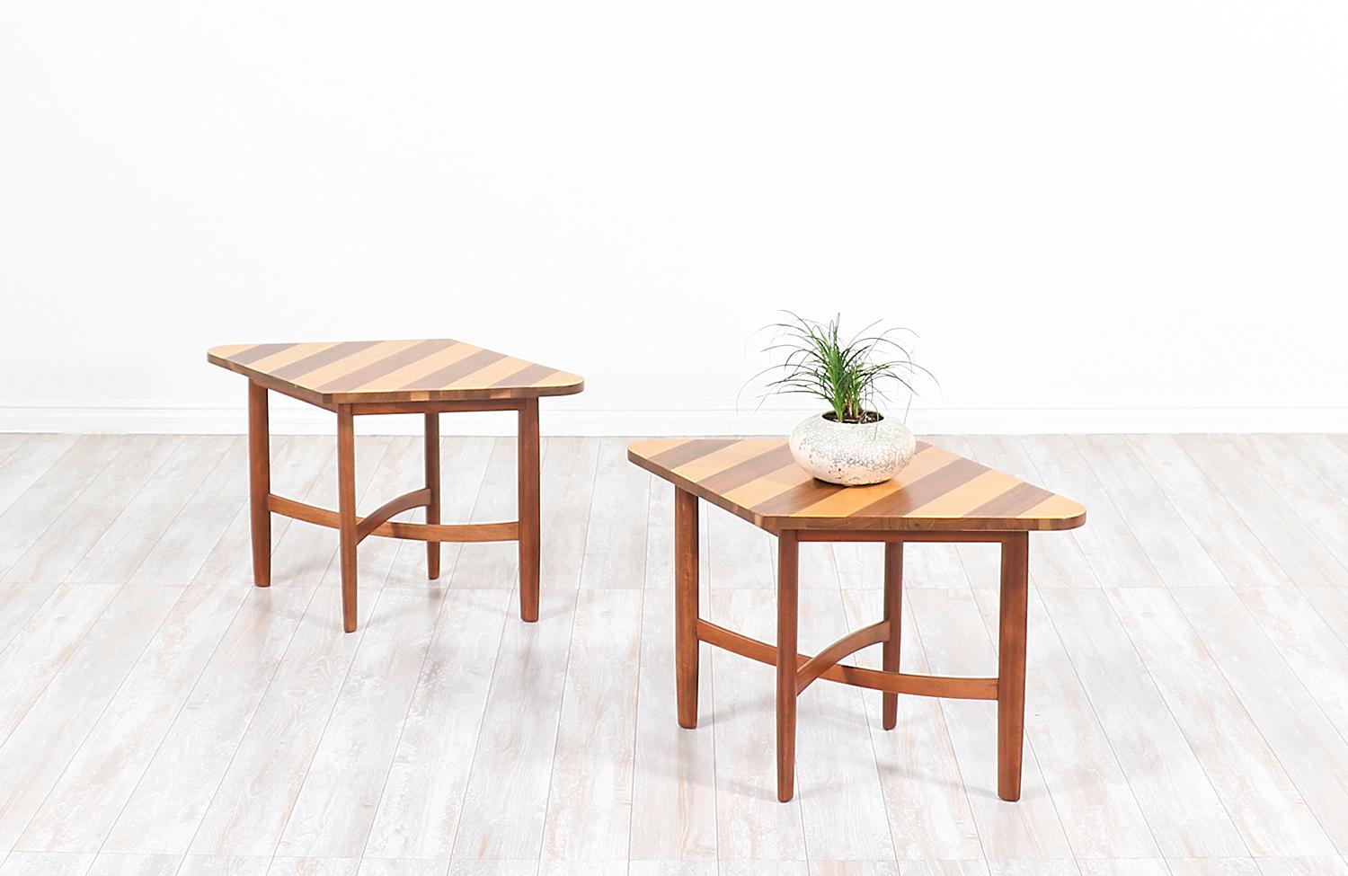Stylish pair of side tables designed by Barney Flagg for Drexel’s Parallel series and manufactured in the United States, circa 1960s. These rare and eye-catching design is constructed of walnut wood and birch wood with parallel stripes design on
