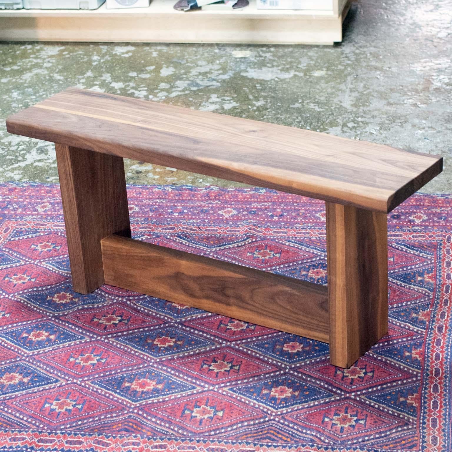 Barney's Bench is hand crated of solid walnut. The design features minimal details, allowing the character of the wood to be the main feature. 

This piece is fully customizable. Customers can specify the dimensions, wood species, and wood