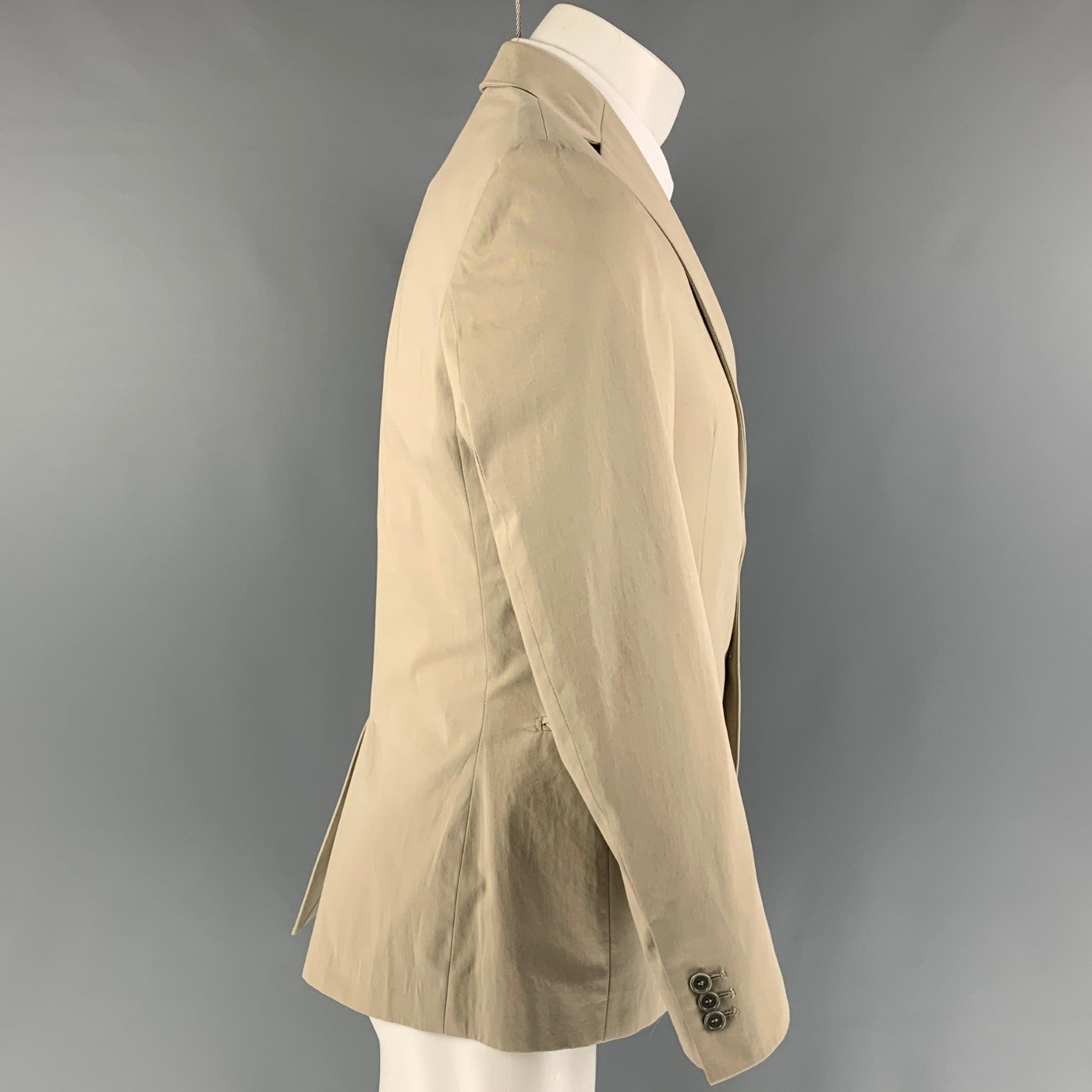 BARNEY'S CO-OP sport coat comes in a khaki cotton featuring a notch lapel, flap pockets, single back vent, and a double button closure. Made in Italy.
 Very Good
 Pre-Owned Condition. 
 

 Marked:  46 
 

 Measurements: 
  
 Shoulder:
 17 inches