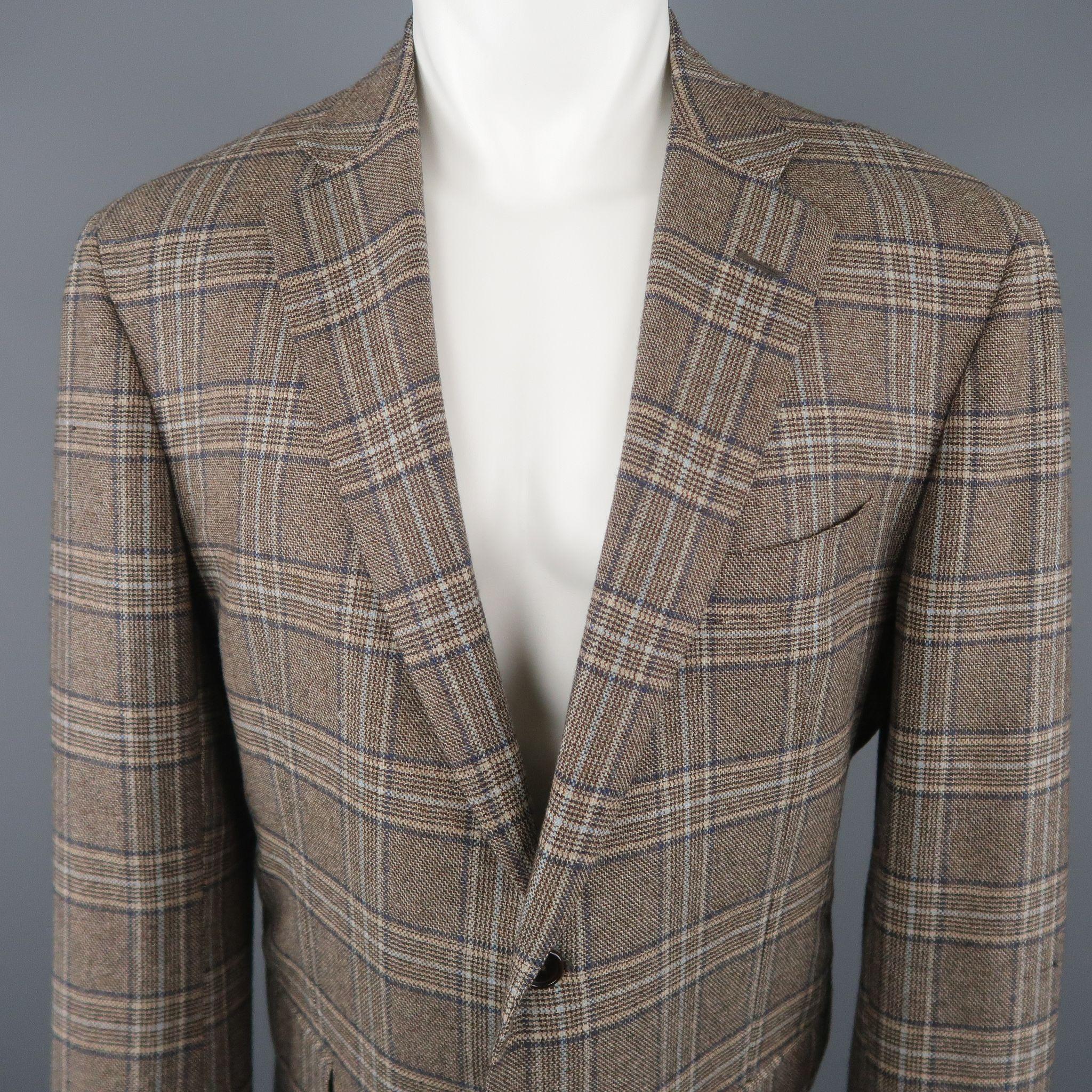 BARNEY'S NEW YORK sport coat comes in taupe plaid cashmere with a notch lapel, two button, single breasted front, and flap pockets. Made in Italy
 
Excellent Pre-Owned Condition.
Marked: IT 54
 
Measurements:
 
Shoulder: 19 in.
Chest: 44 in.
Sleeve: