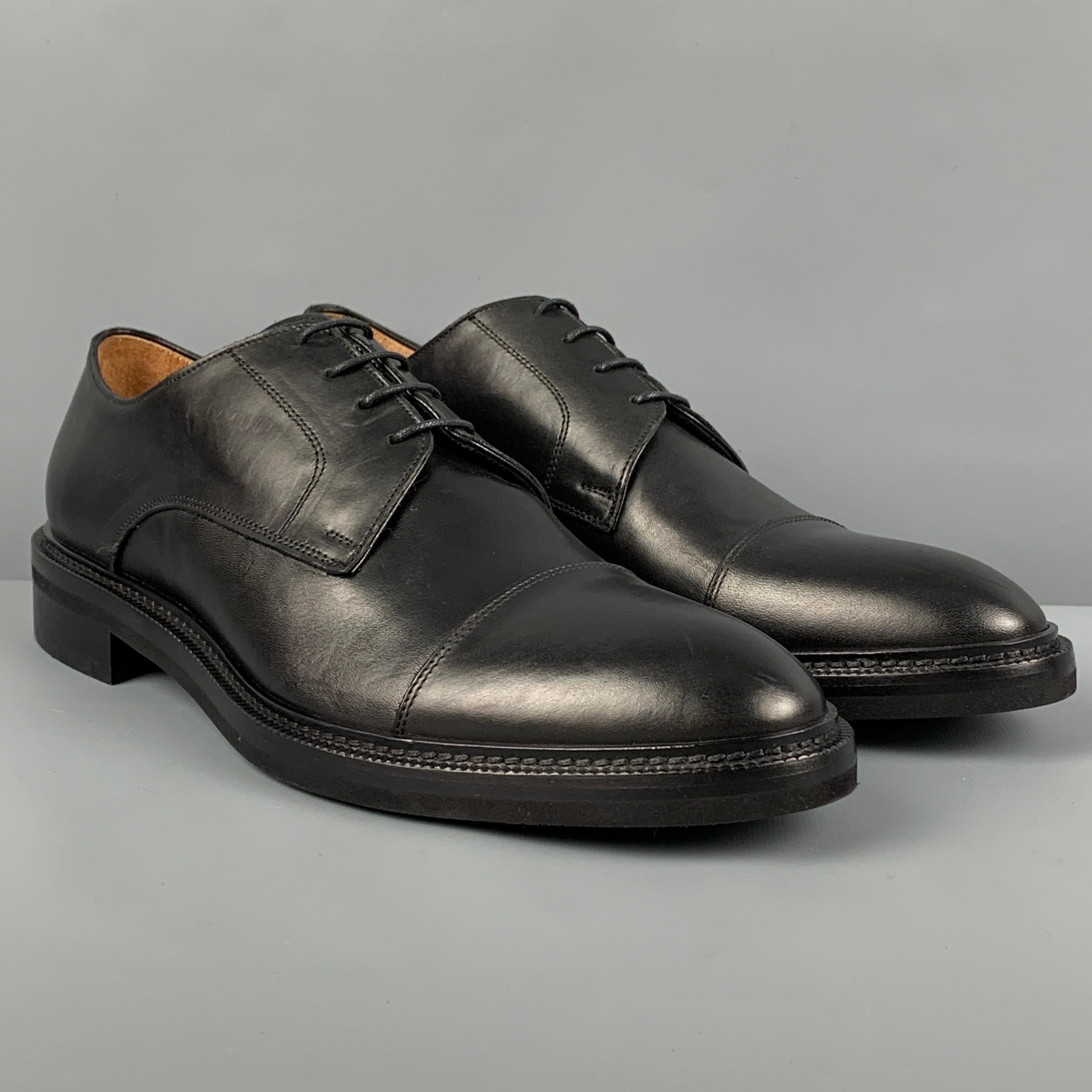 BARNEY'S NEW YORK shoes comes in a black leather featuring a cap toe and a lace up closure. Made in Italy. 

Excellent Pre-Owned Condition.
Marked: 12

Outsole: 13.25 in. x 4.5 in. 