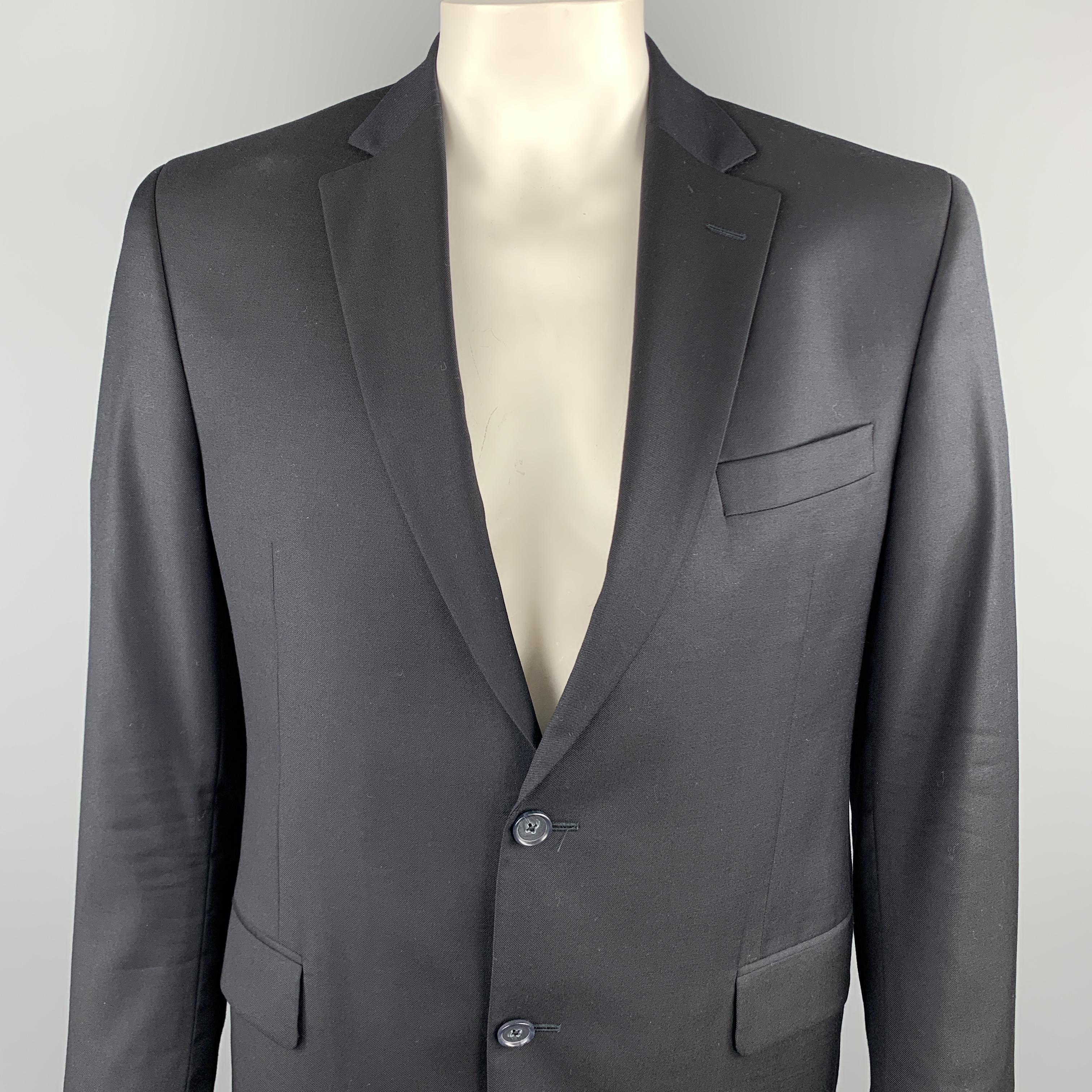 BARNEYS NEW YORK sport coat comes in a black wool fabric by Loro Piana featuring a notch lapel style, flap pockets, and a two button closure. 

Excellent Pre-Owned Condition.
Marked: 42

Measurements:

Shoulder: 18 in. 
Chest: 40 in. 
Sleeve: 26 in.