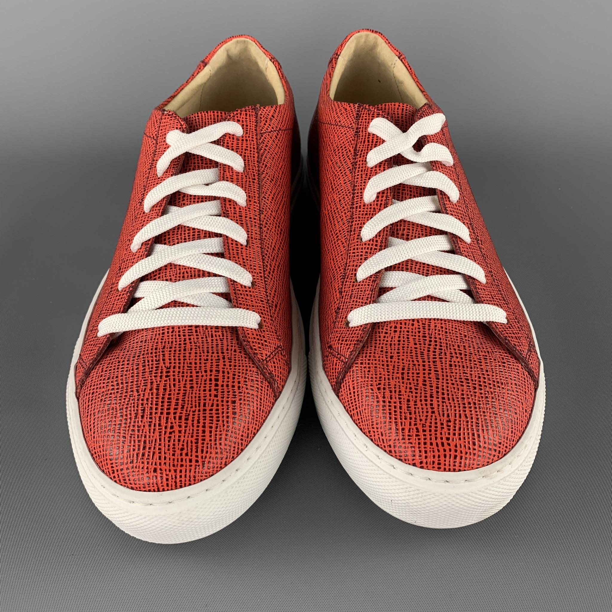 BARNEY'S NEW YORK low top sneakers come in orange and black textured leather with a white rubber sole.  Made in Italy.

Brand New.
Marked: US 8

Outsole: 11.25 x 3.75 in.
SKU: 104005