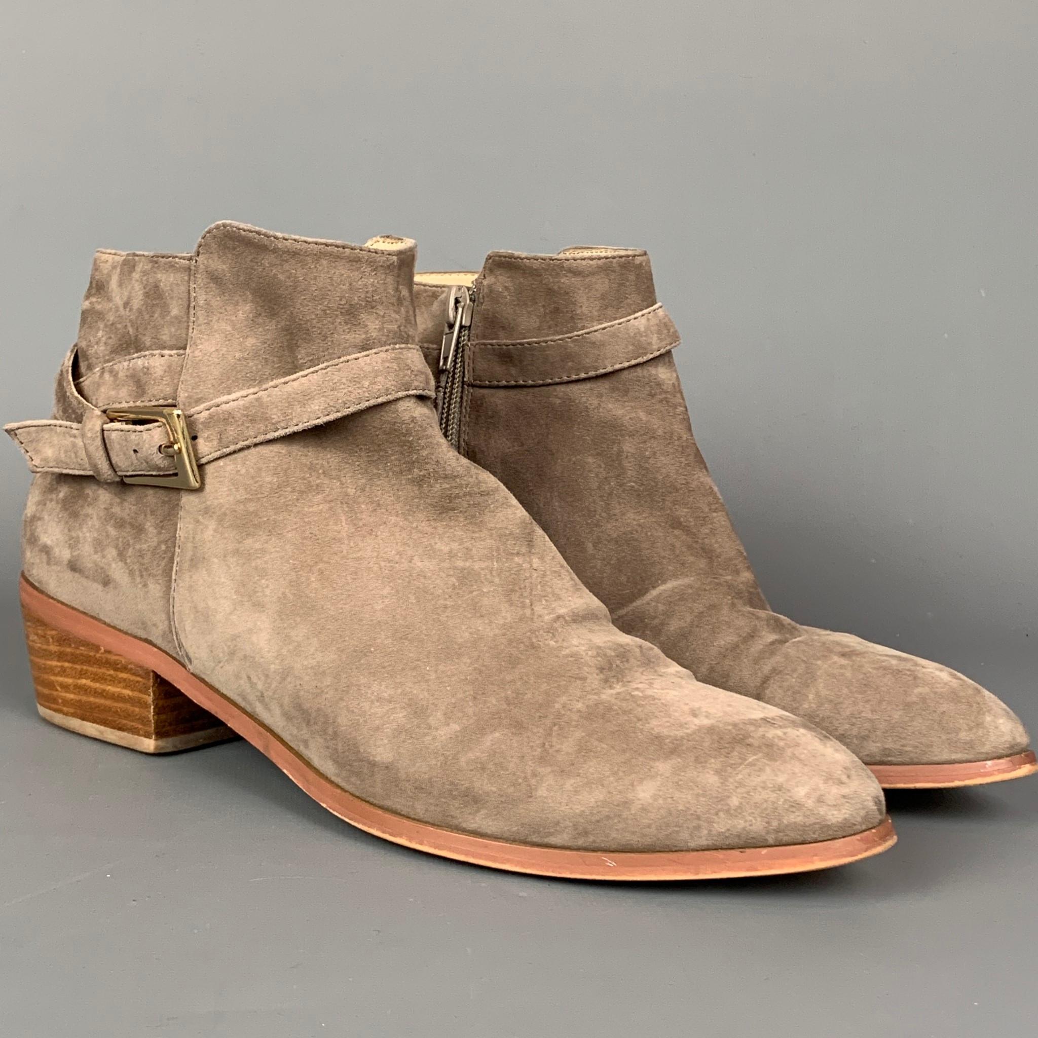 BARNEY'S NEW YORK ankle boots comes in a taupe suede featuring ankle straps, gold tone buckle, wooden sole, anda chunky heel. 

Good Pre-Owned Condition. Minor wear on heel.
Marked: 9

Measurements:

Heel: 1.5 in. 

SKU: 109991
Category: Boots

More