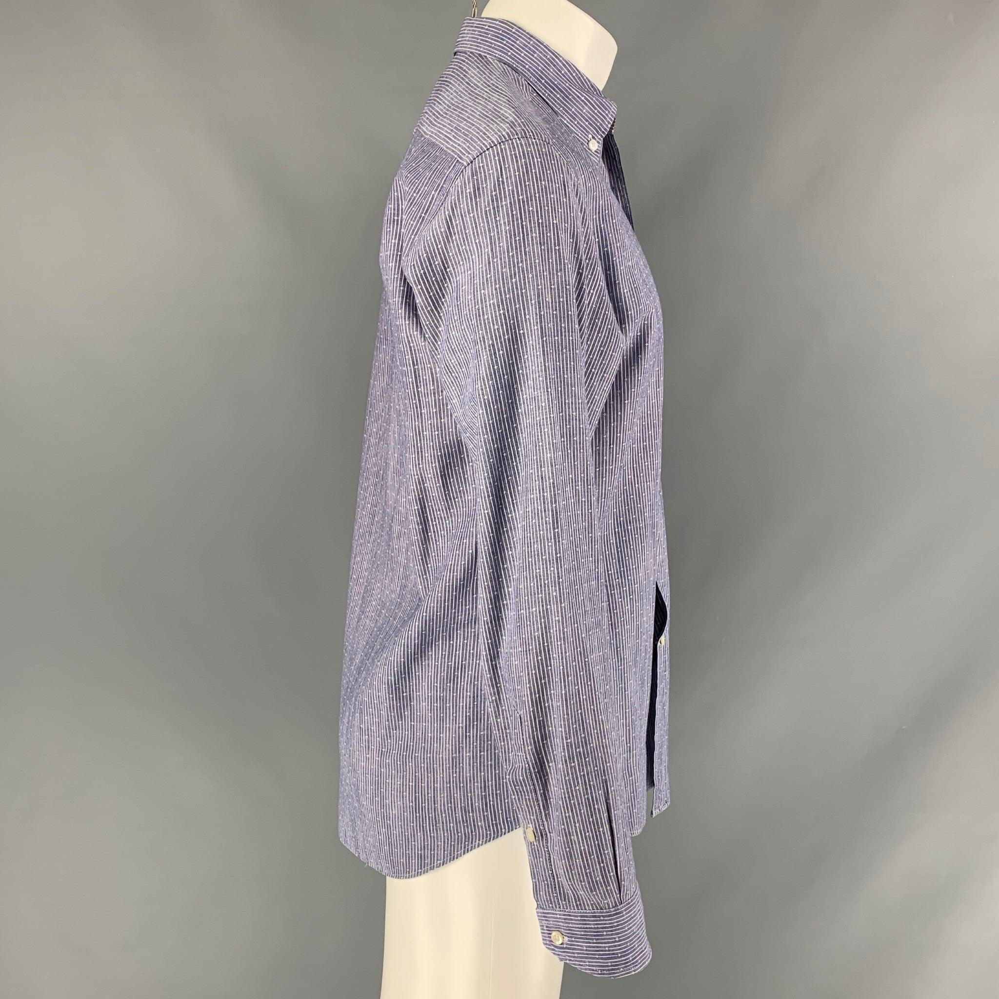 BARNEY'S NEW YORK long sleeve shirt comes in blue and white striped cotton featuring a button down collar, and a buttoned closure. Made in Spainches Excellent Pre-Owned Condition. 
 

 Marked:  M 
 

 Measurements: 
  
 Shoulder: 17.5 inches Chest: