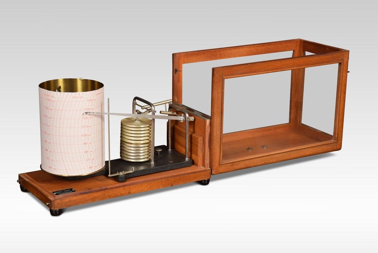 Mahogany framed barograph by R Fuess Berlin. The mechanical eight-day movement is housed in the drum, fitted with a seven-day chart which covers one full rotation of the drum. The ink trace, or barogram, on the recording paper is a visual record of