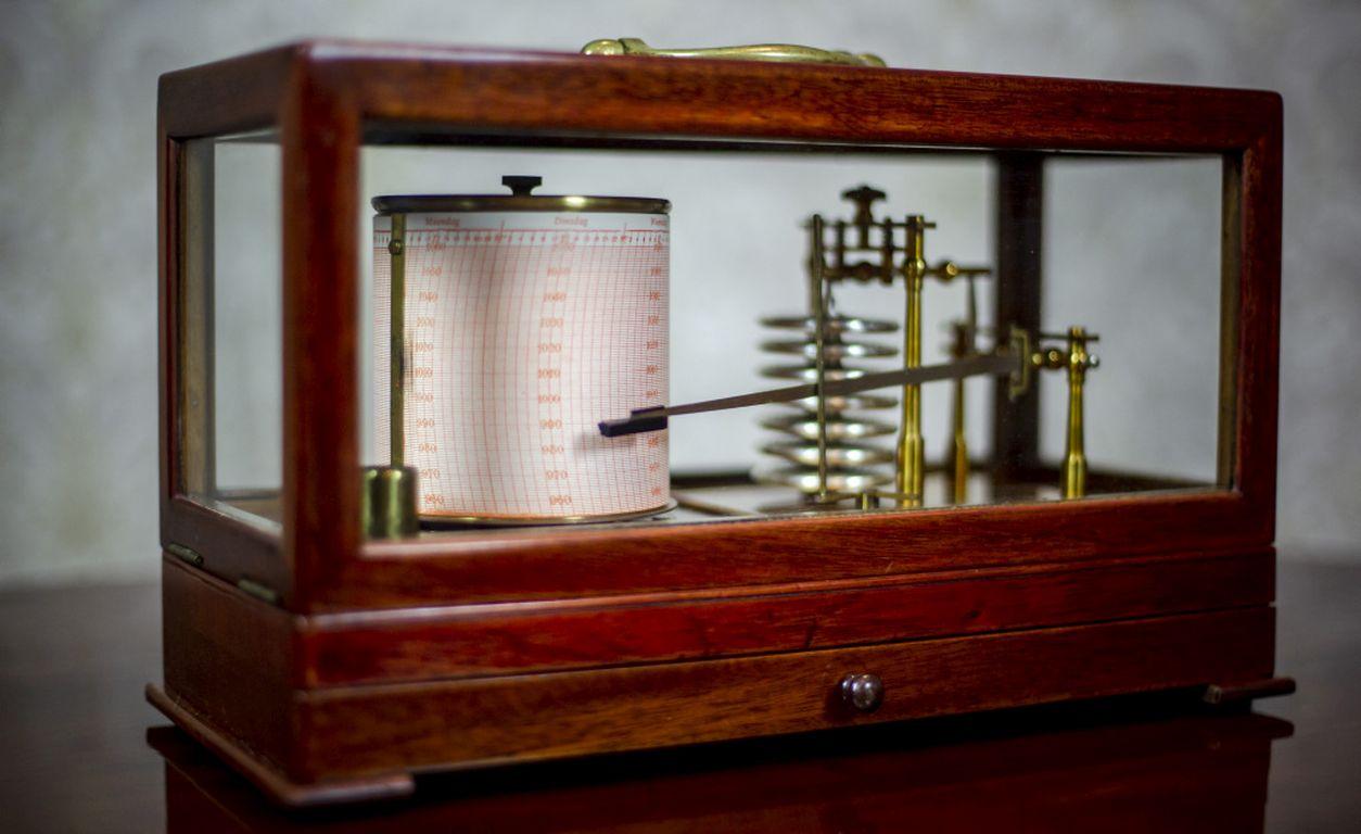 We present you a Sestrel barograph to measure atmospheric pressure. 
This device registers changes in pressure by a pen on paper. 
The results are saved on a special paper tape, placed on a rotating drum, which is turned on by a clock