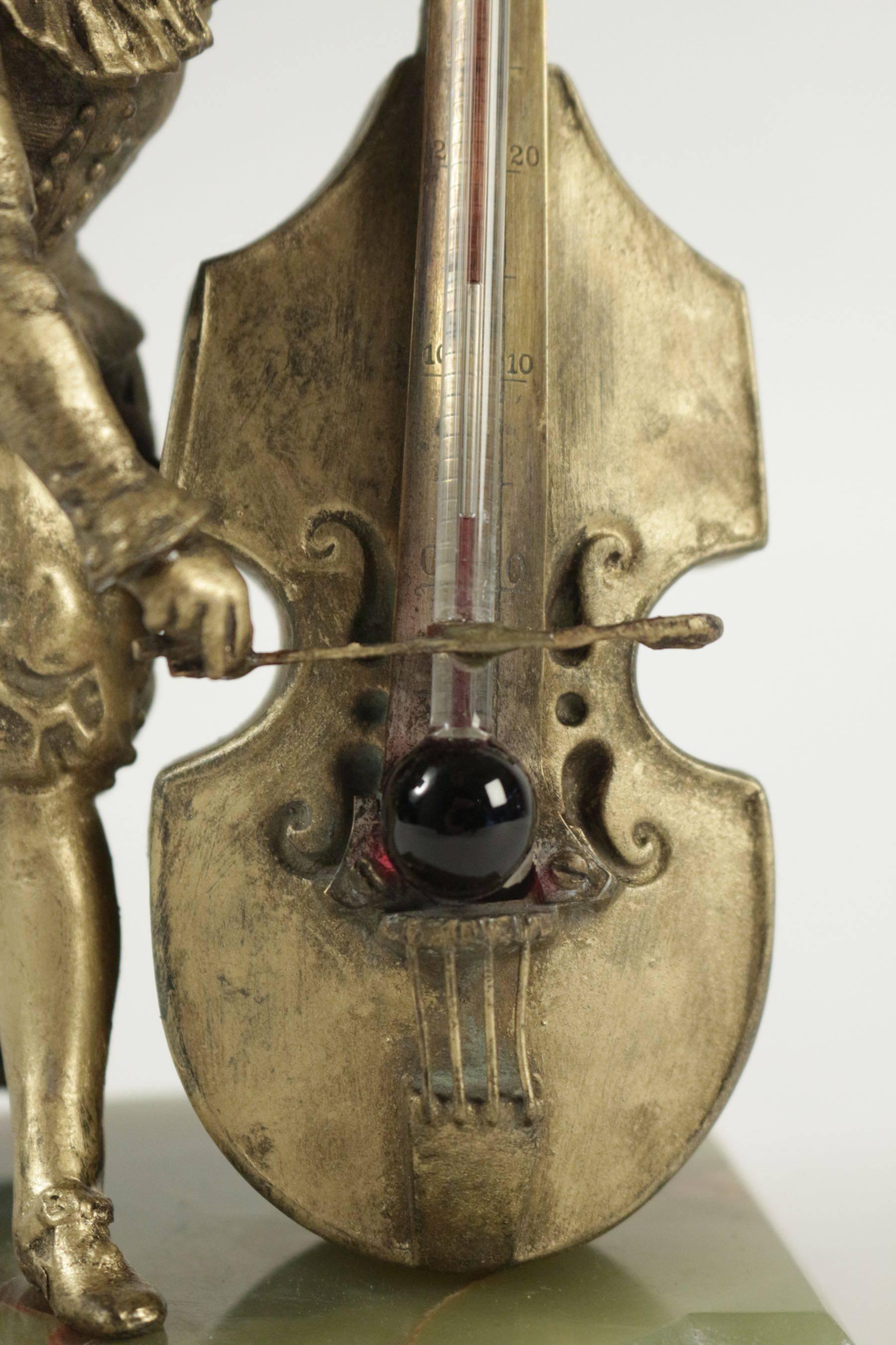 French Barometer Regulates and Base in Semi-Precious Stone Representing a Cello Player For Sale