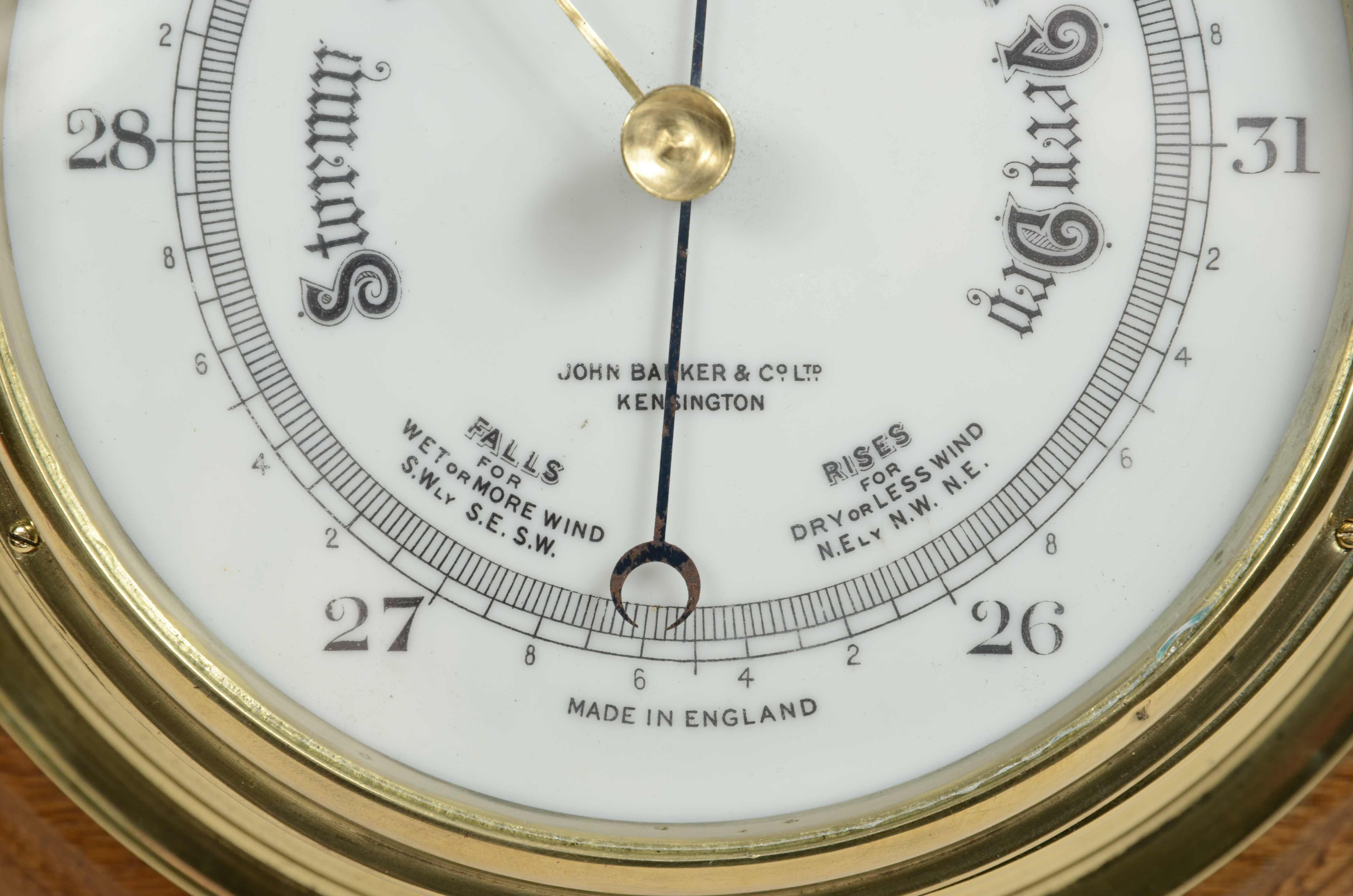 Brass wall-mounted aneroid barometer  signed John Barker & Son, early 1900s. In Good Condition In Milan, IT