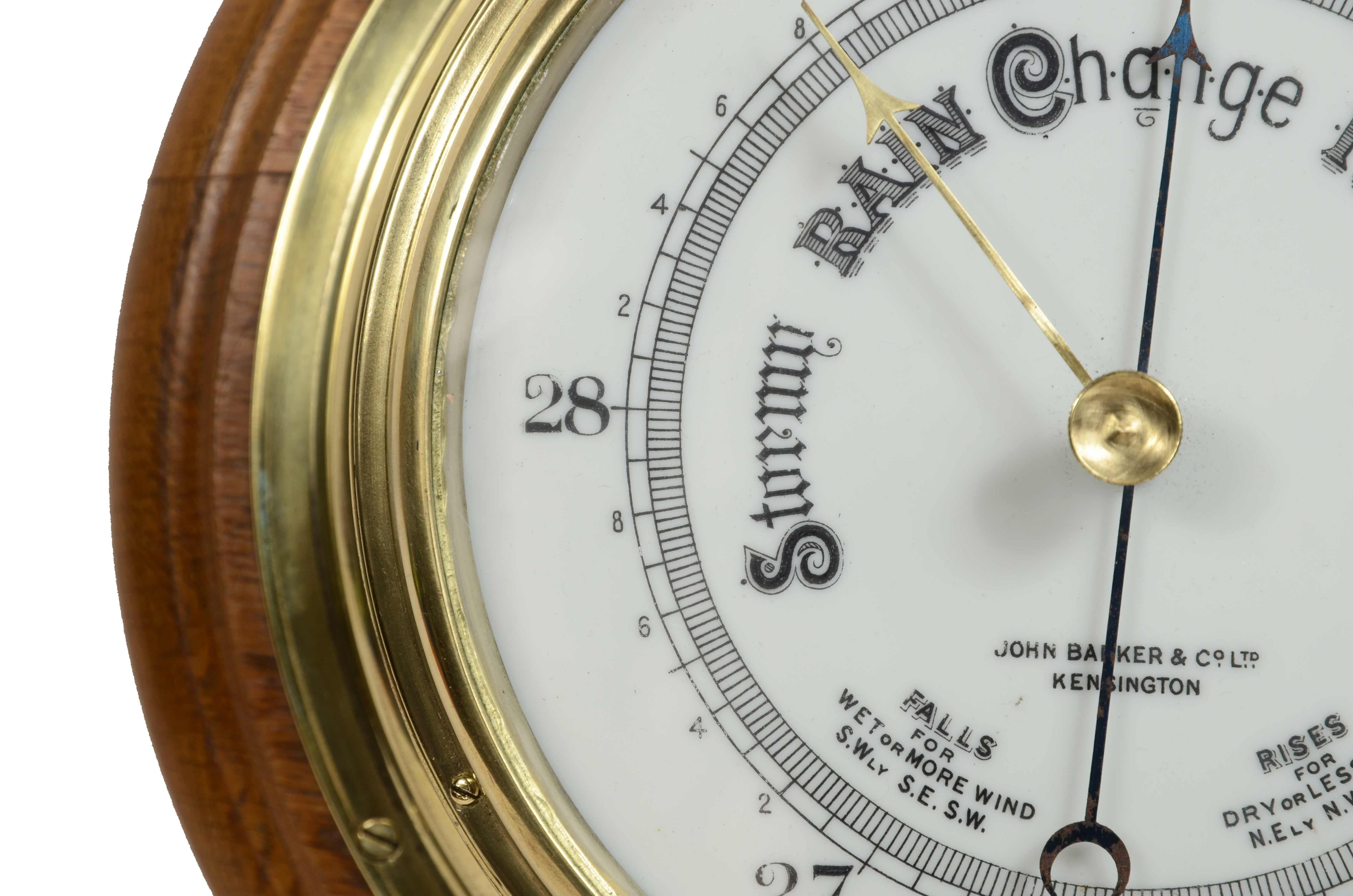 Brass wall-mounted aneroid barometer  signed John Barker & Son, early 1900s. 1