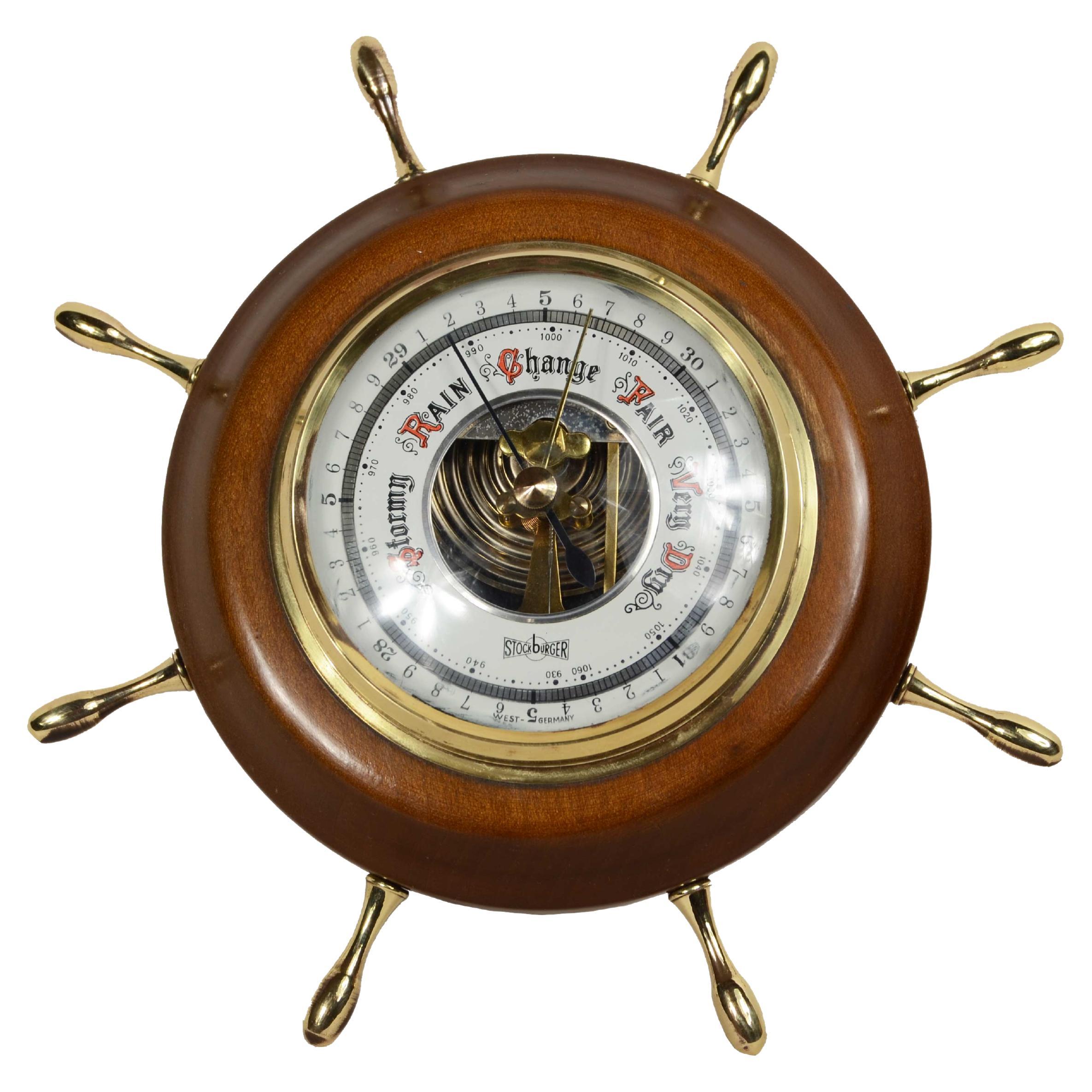 Rudder-shaped aneroid barometer with 8 brass ankles from the 1950s