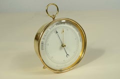 Brass aneroid table and wall barometer England late 19th century.