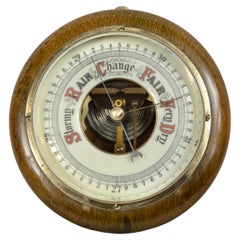 1930s English aneroid barometer made of turned wood, brass and glass