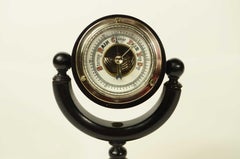 Aneroid barometer on turned ebony base of fine workmanship late 19th cent