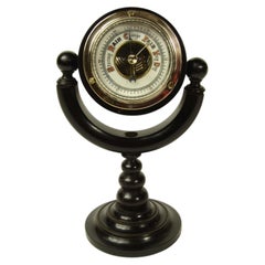 Aneroid barometer on turned ebony base of fine workmanship late 19th cent