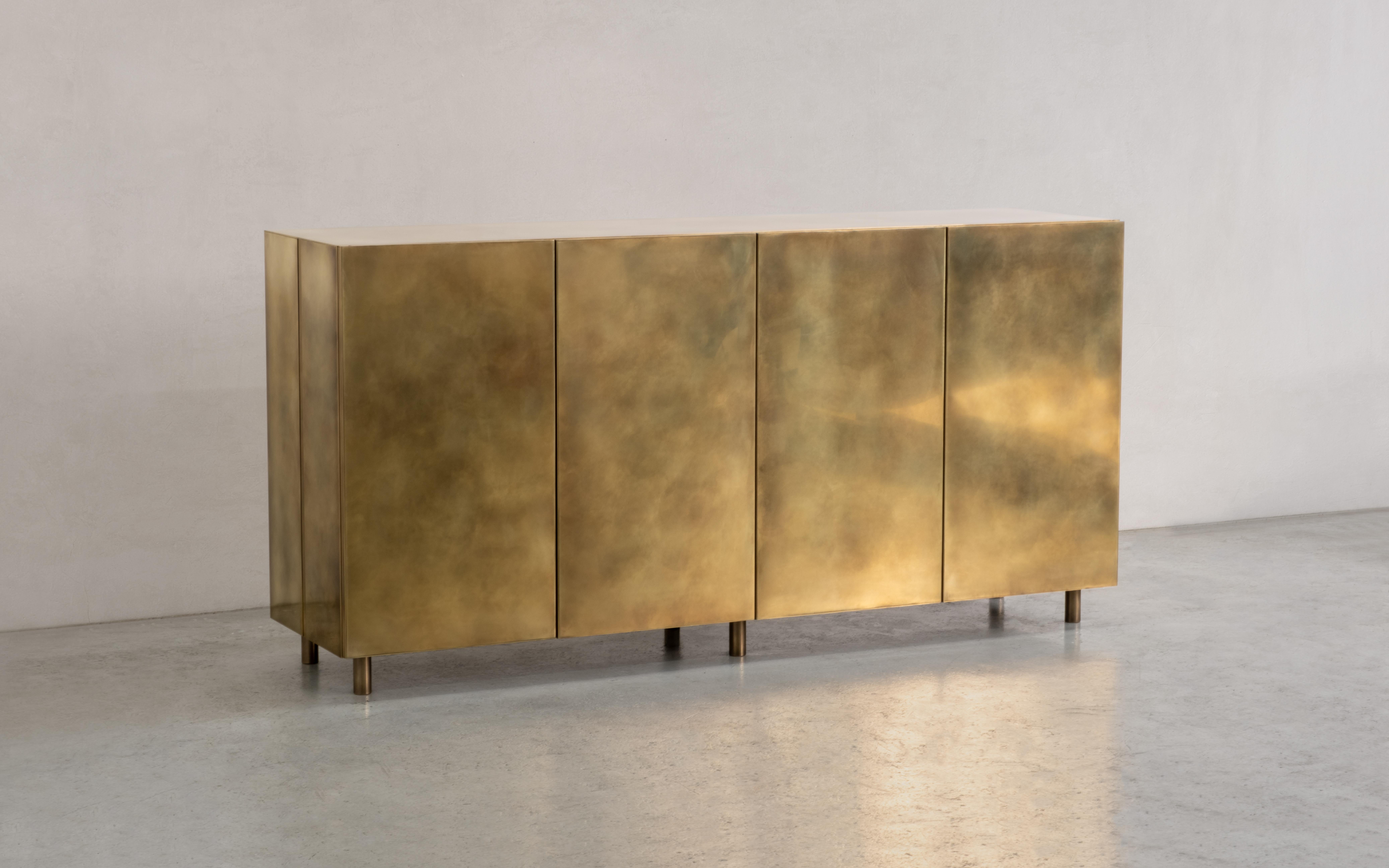 A four-doored sideboard in hand-patinated brass. Each door operates on push-to-open, soft-close hinges.

Handcrafted in the North to order, this sideboard can be commissioned in bespoke sizes, configurations and finishes.

Measures: 100cm height x