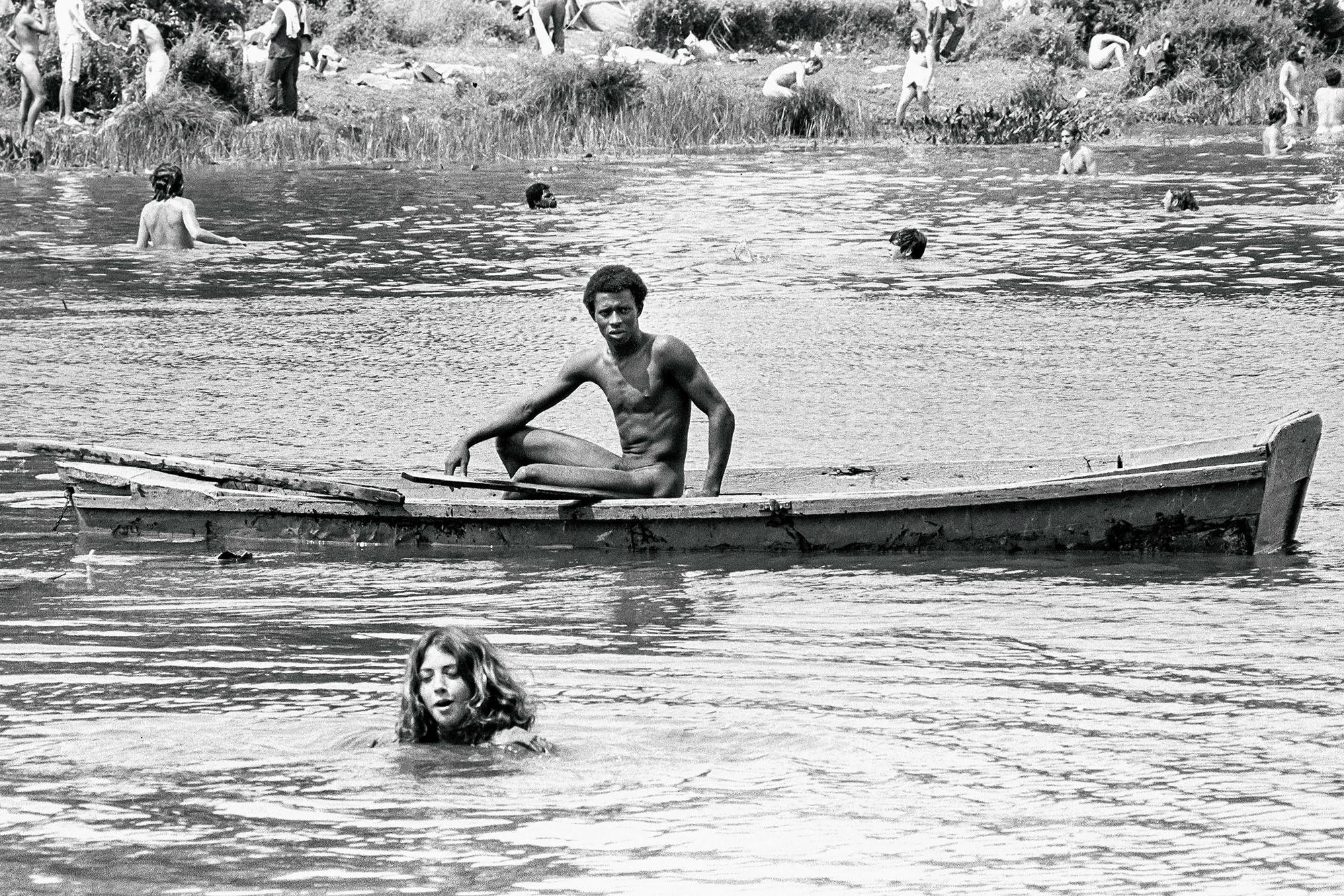 Baron Wolman Figurative Photograph - Woodstock 1969, Canoe Man