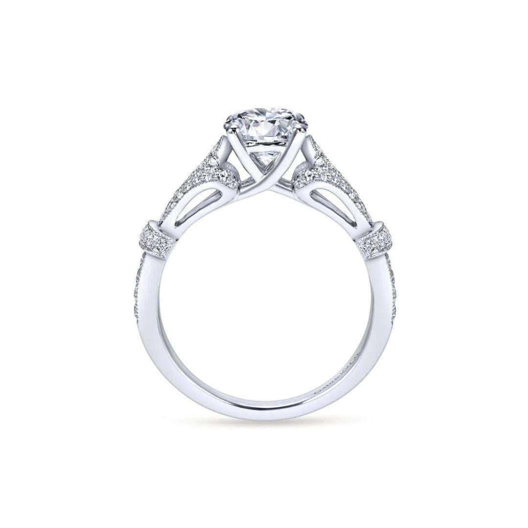 Vintage inspired diamond engagement mounting in 14k white gold. Ring features 0.31 ctw of round brilliant cut natural white diamonds, H color, SI clarity, pave set. Center diamond NOT included.