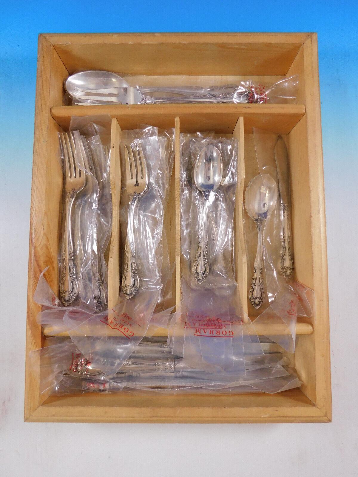 Unused Baronial New by Gorham, c1973, sterling silver flatware set - 28 pieces. The handles of the forks and spoons are pierced. This set includes:

6 place knives, 9 1/4