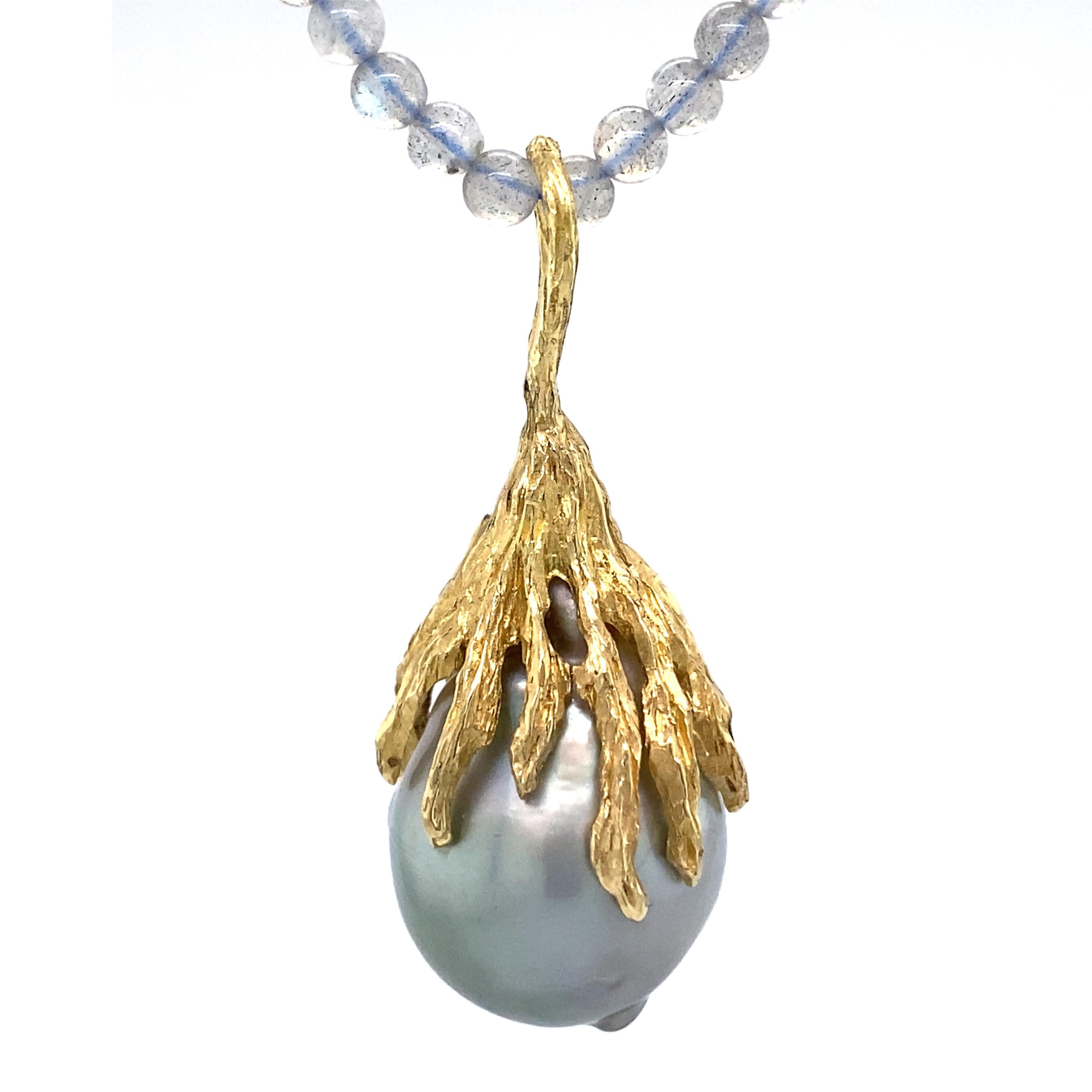 This gorgeous, shimmery, one-of-a-kind pendant by Eytan Brandes features a huge, astounding silver-blue baroque Tahitian pearl -- over 16mm wide.  

We purchased this pearl from Seven Seas Pearls in downtown Los Angeles.  Seven Seas only sells