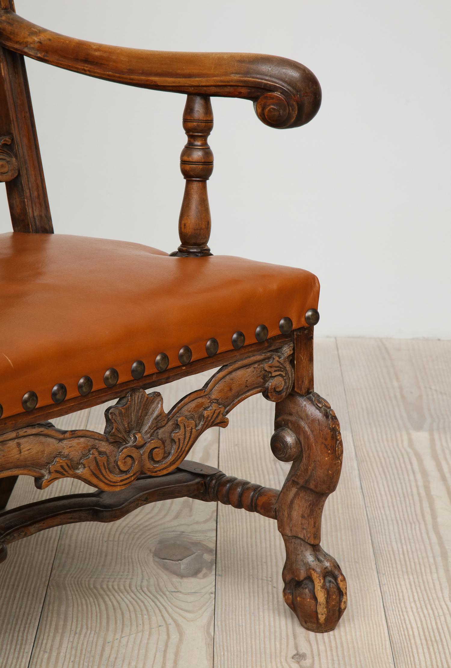 Exceptional Swedish Baroque 18th century armchair, circa 1740, origin: Sweden, with beautifully carved details such as shells, scrolls on ball and claw feet.  Original stamp (brass): Crown Statsverket  / no. 77 (see photograph)

Great occasional or