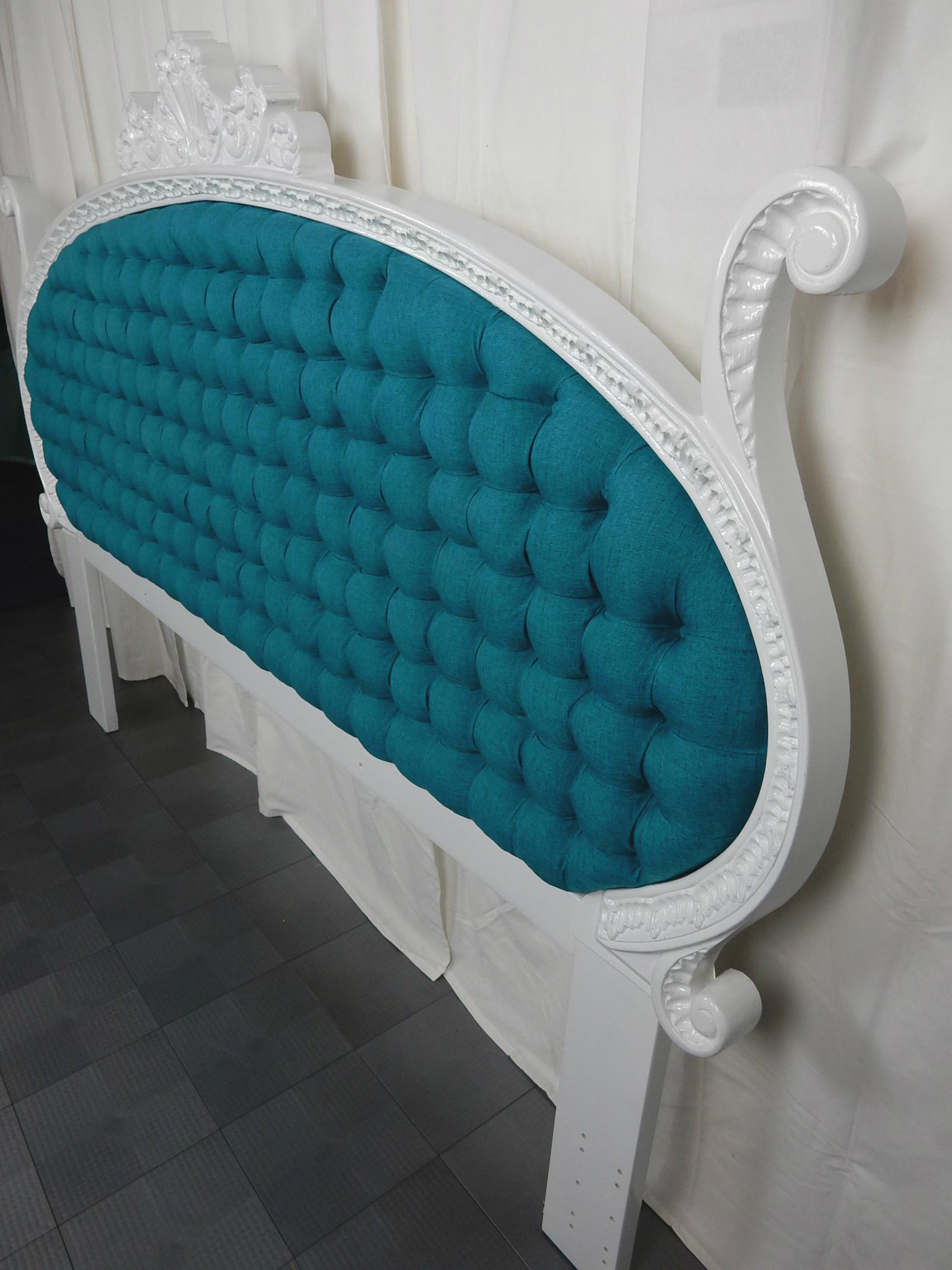  1960s Hollywood Regency king size tufted headboard in the style of Dorothy Draper design.
Newly upholstered in teal blue silk including foam. Creamy white gloss enamel over baroque carved wood.
Bed frame mounting holes measure between 73-76 inches