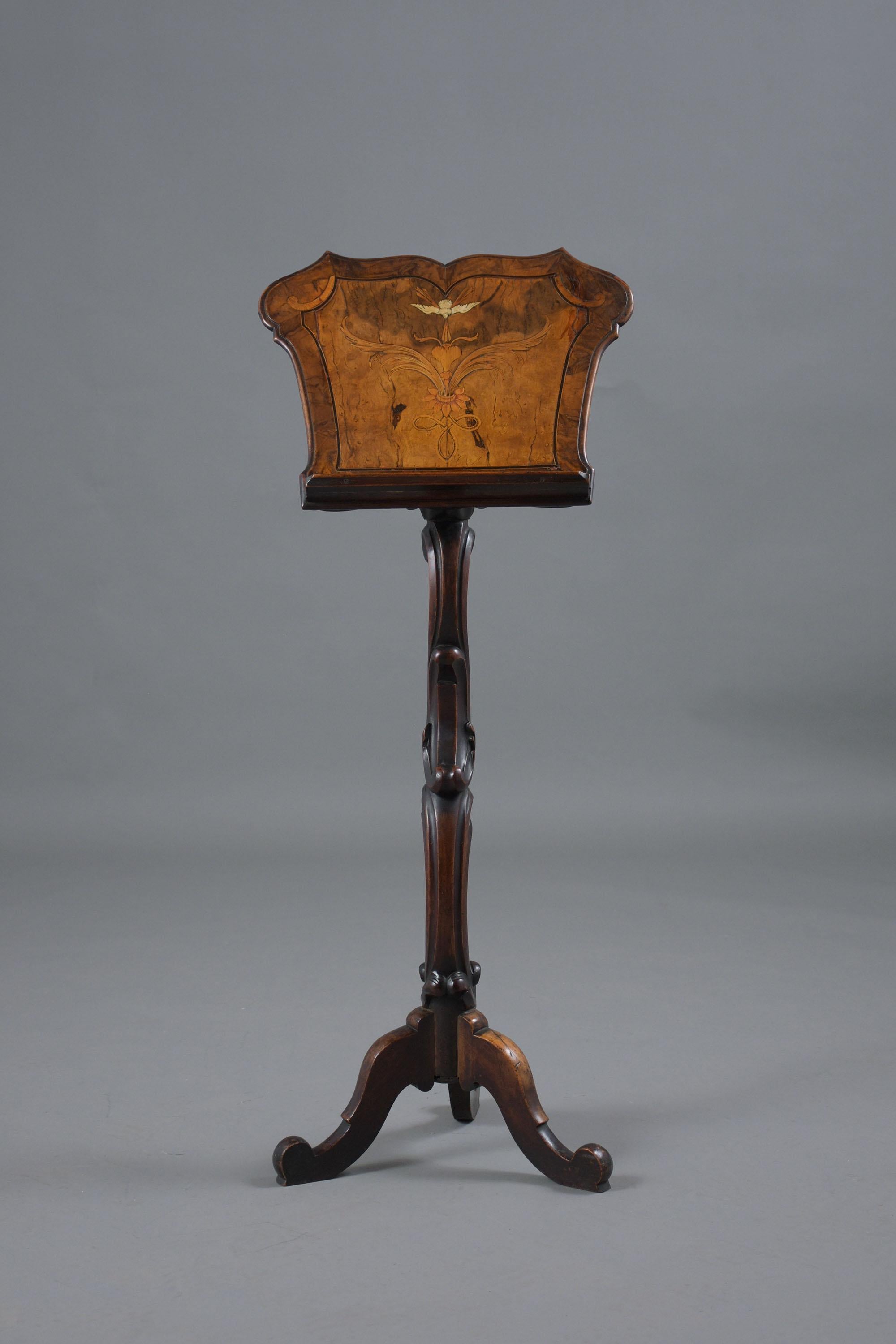 An extraordinary 19th Century Carved Music Stand hand-crafted out of wood in great condition has been professionally restored and has only waxed and polished developing a beautiful patina finish. The music stand features remarkable inlaid details