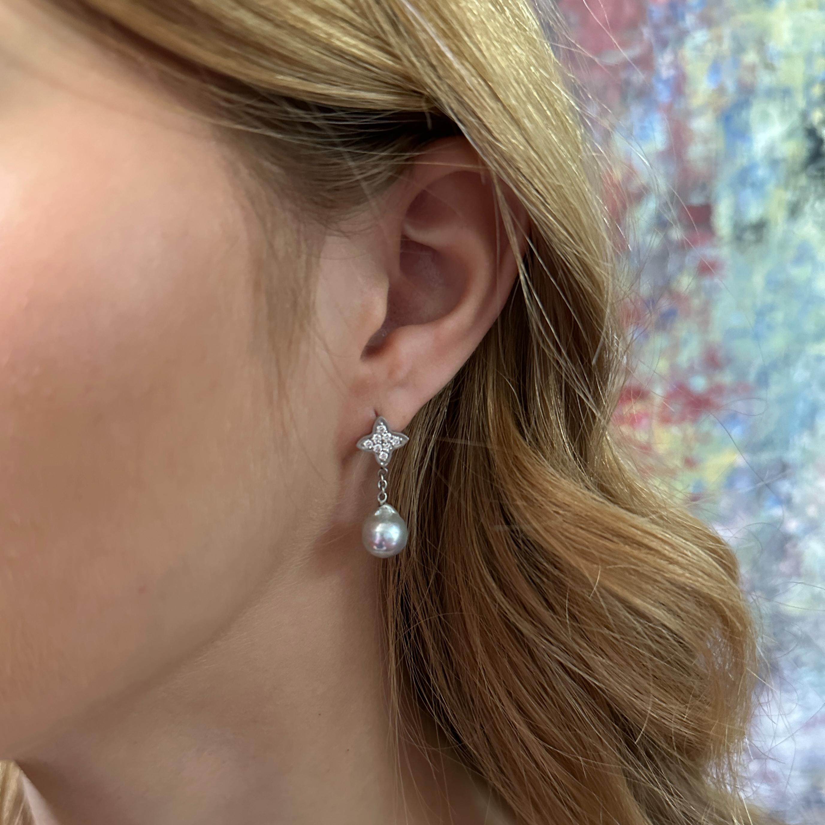 Perfectly pretty and easy to wear, these new platinum post earrings by Eytan Brandes feature frosty silver-blue Japanese saltwater cultured (i.e., Akoya) pearls dangling from pointy little platinum quatrefoils pavé-set with tiny diamonds.

The