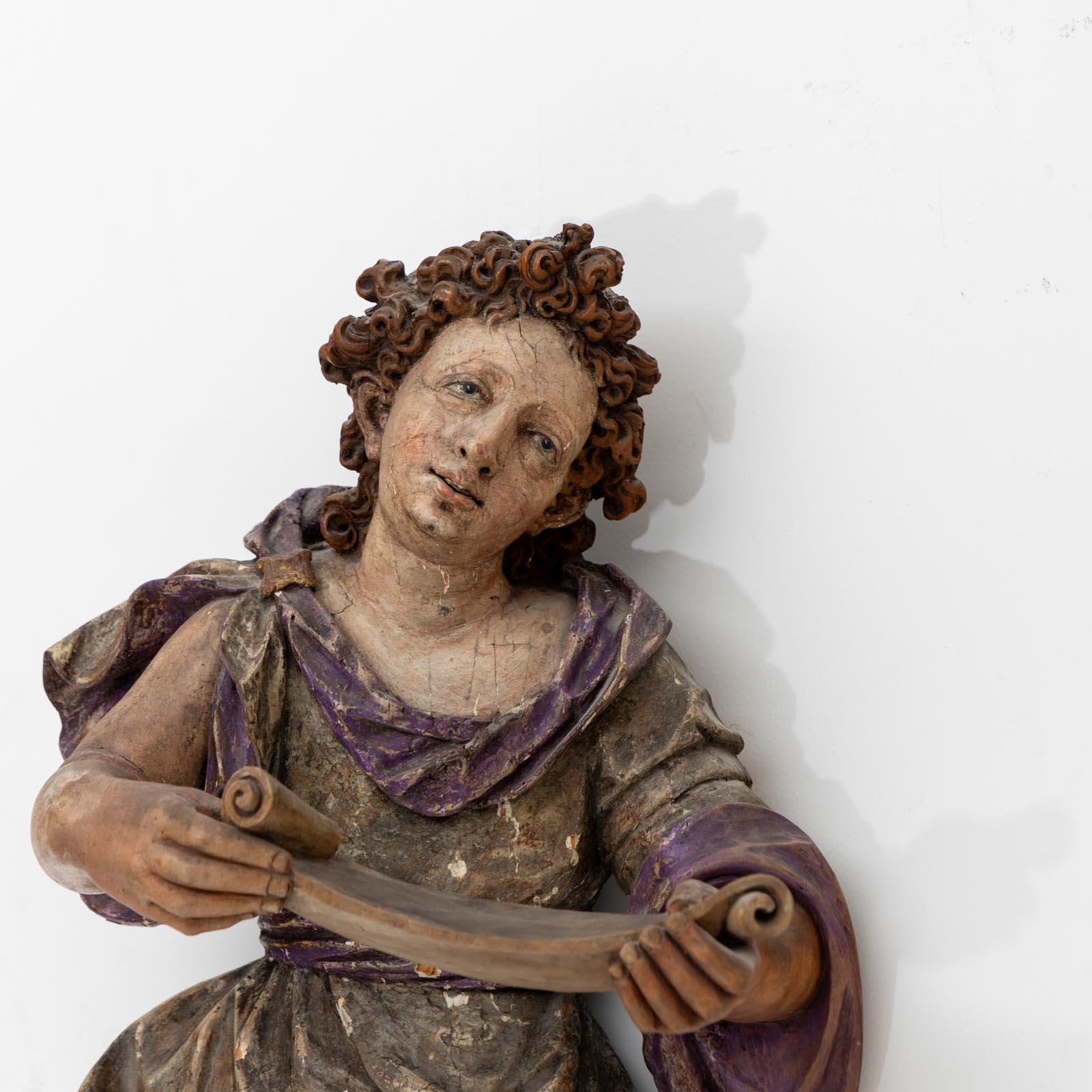 Painted Baroque Angel with Scroll, Late 17th Century For Sale