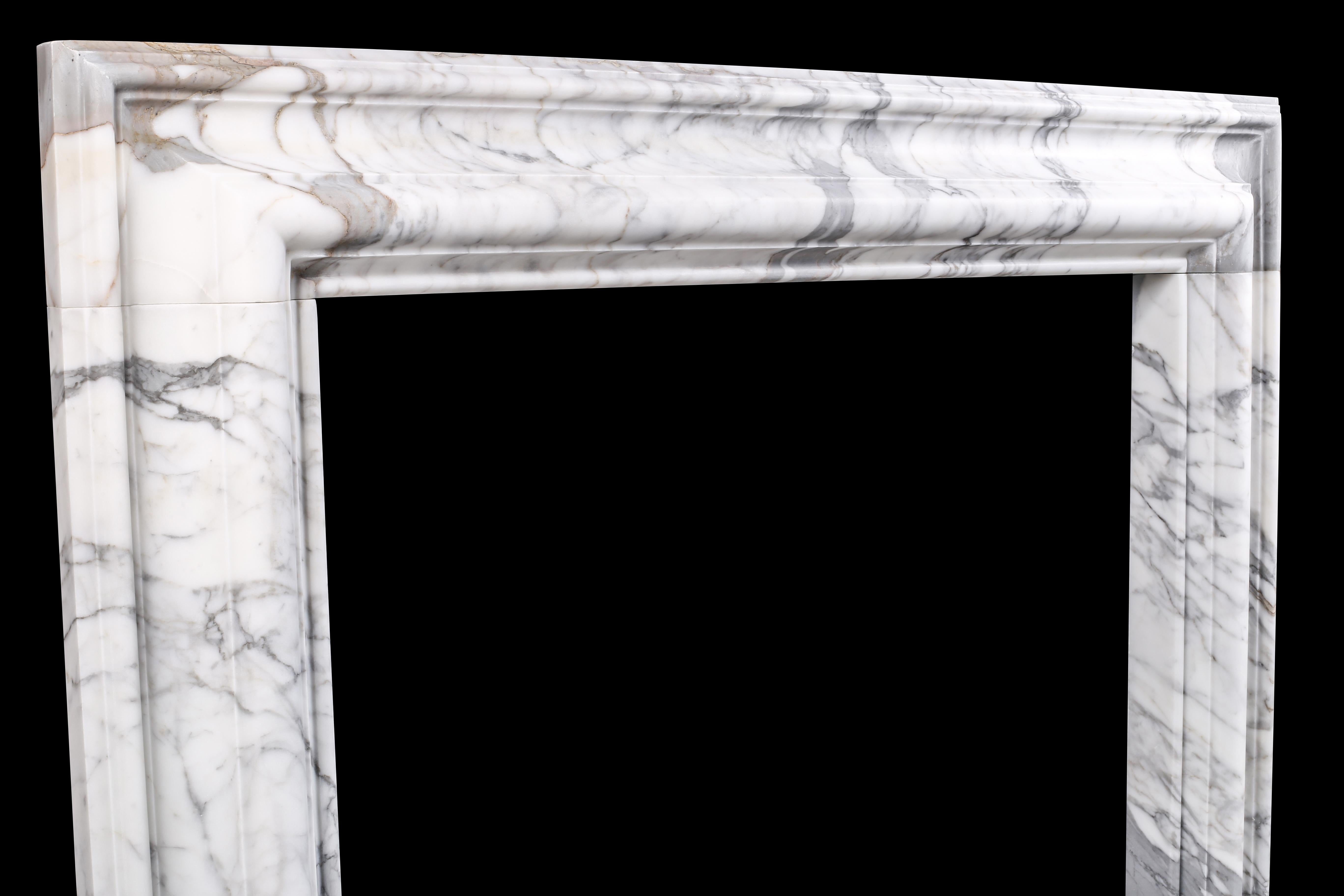 A Baroque Bolection Chimneypiece in Italian white statuary marble fireplace 4

A Baroque style Bolection fireplace surround of bold proportions with very finely carved columns with a rising ogee edging, which are supported on substantial