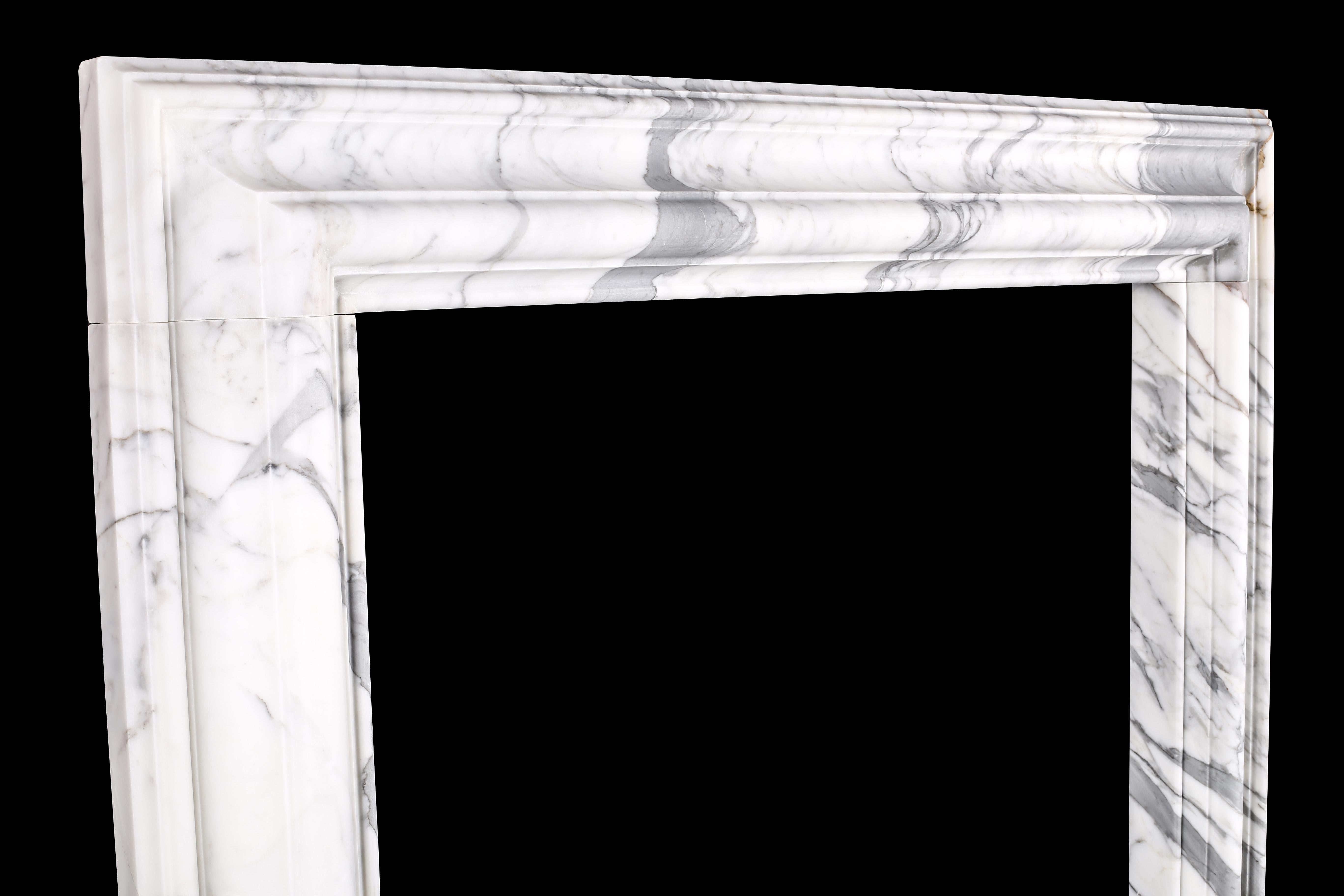 A baroque bolection fireplace surround Italian white statuary marble fireplace 6.

A baroque style bolection fireplace surround of bold proportions with very finely carved columns with a rising ogee edging, which are supported on substantial