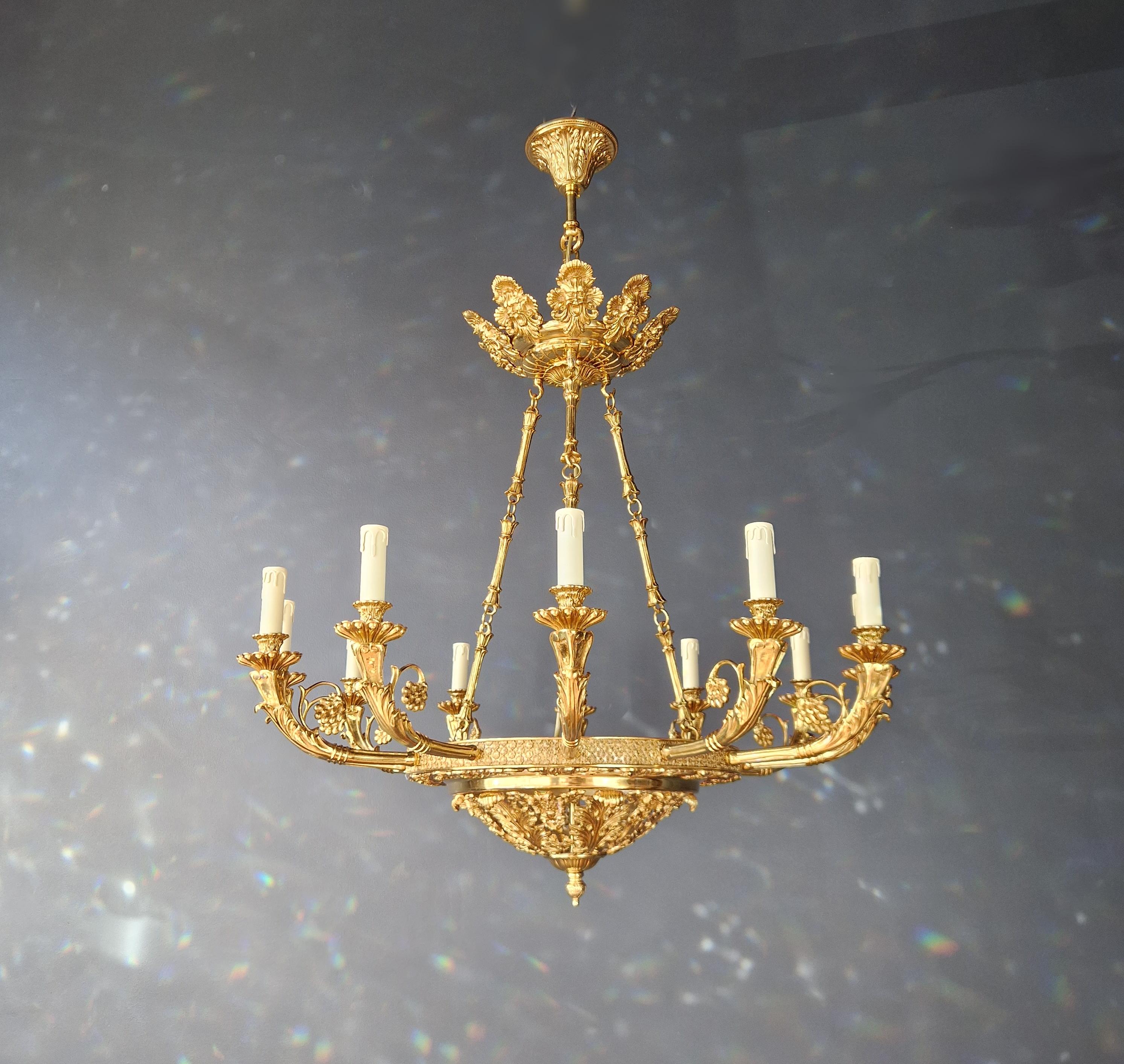 Introducing a stunning Brass Baroque Empire  Chandelier, an exquisite piece adorned with captivating, reminiscent of the classical style of the Empire era. This is a new reproduction, and several are available, ensuring you can bring this classic