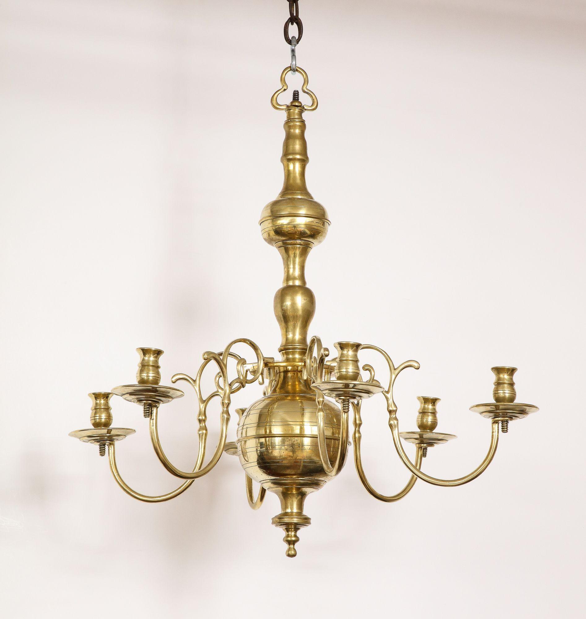 Fine 18th century brass six-light chandelier having ball and ring turned shaft with six curved arms ending in original brass candle sockets.