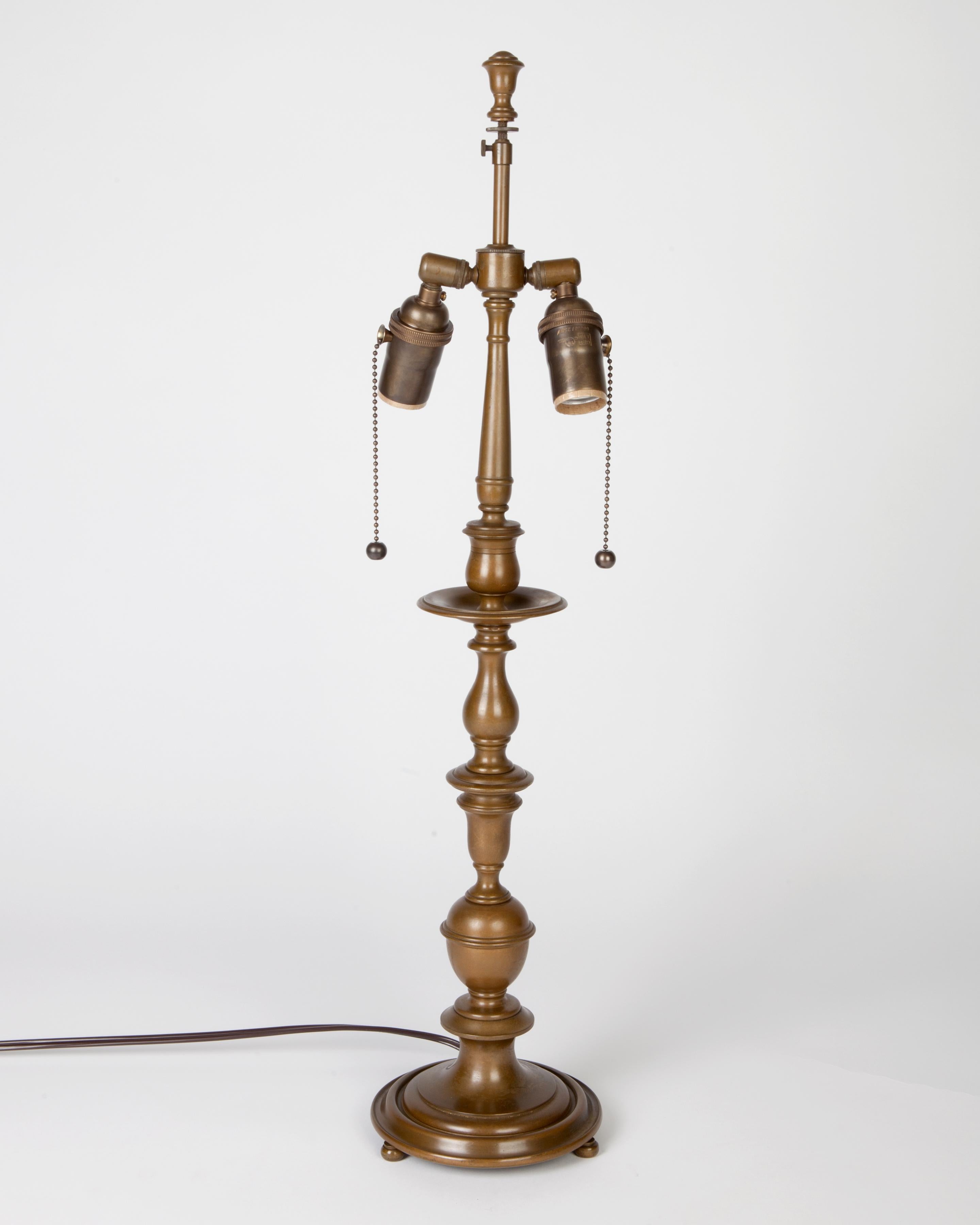 ATL1901
A bronze Baroque desk lamp in its original age-darkened finish signed by the New York maker E. F. Caldwell circa 1950s. It’s quite similar, though not an exact match to those in the great reading hall of the 42nd Street branch of the New