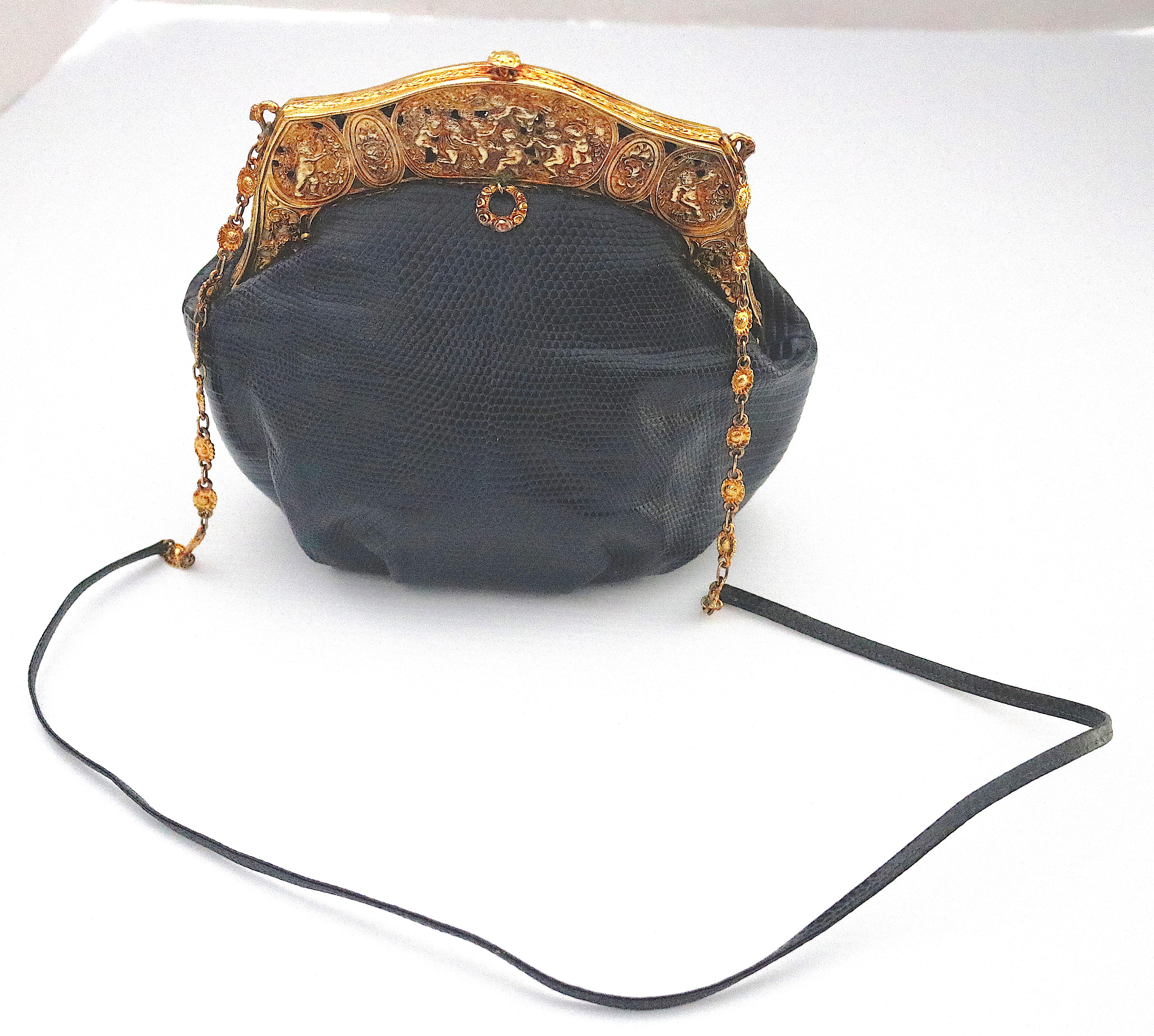A true piece of Fashion Art and History to be admired and worn!                                                                   
Gorgeous updated for today- Heirloom Black Lizard Day or Evening Bag designed with a Baroque antique circa 1925 -22
