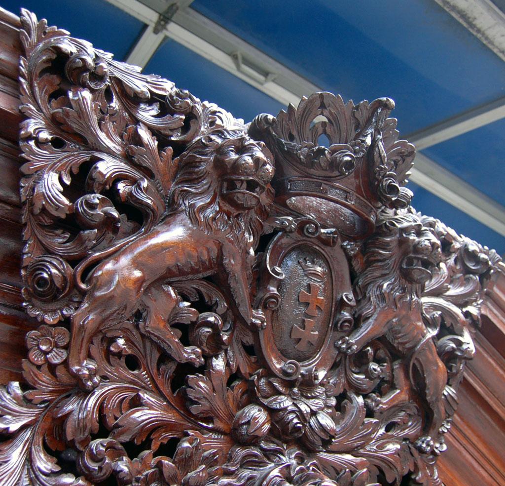 Large imposing Baroque cabinet from Gdansk, 1890s. Made according to designs from the time circa 1720. Very elaborately crafted masterpiece with rich carvings from the period of historicism. Made of oak.

Pressed ball feet, triple pedestal, three