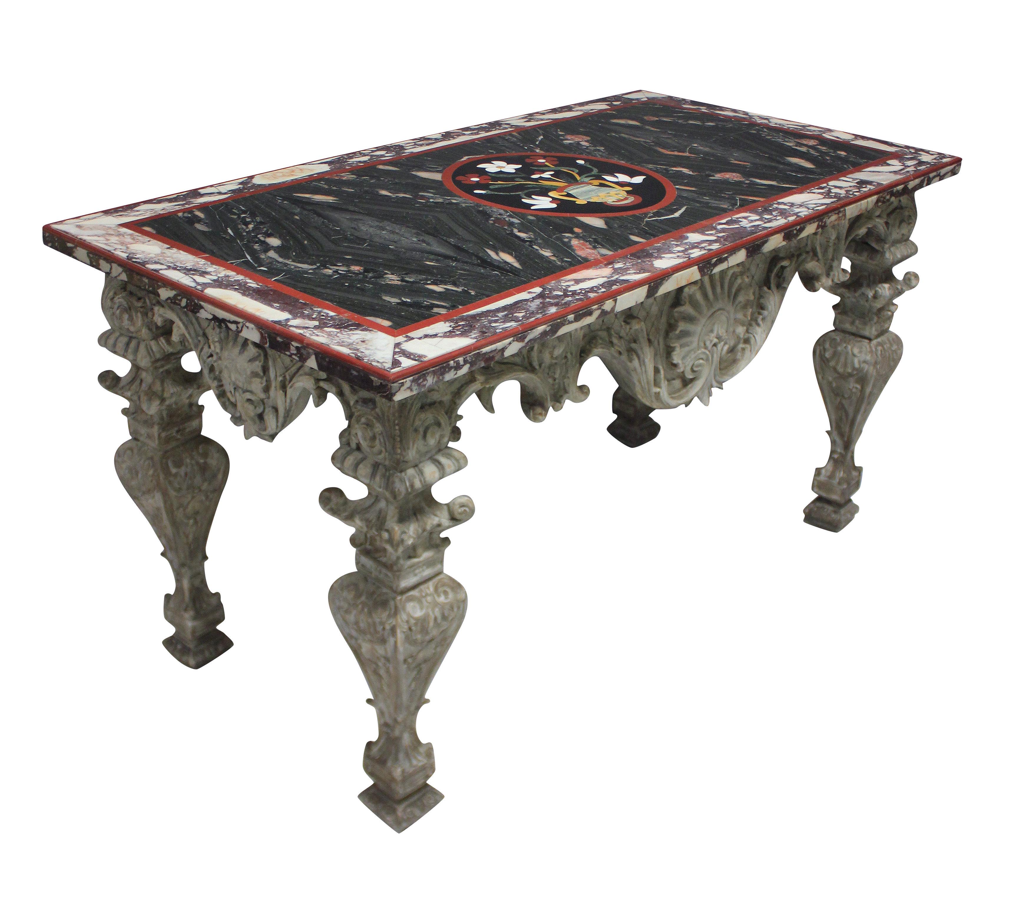 An Italian Baroque heavily carved and distressed painted walnut centre table. With shell and acanthus detailing throughout, supporting a fine pietra dura marble top. The top in various marbles & hardstones, with a shaped carnelian edge, with a