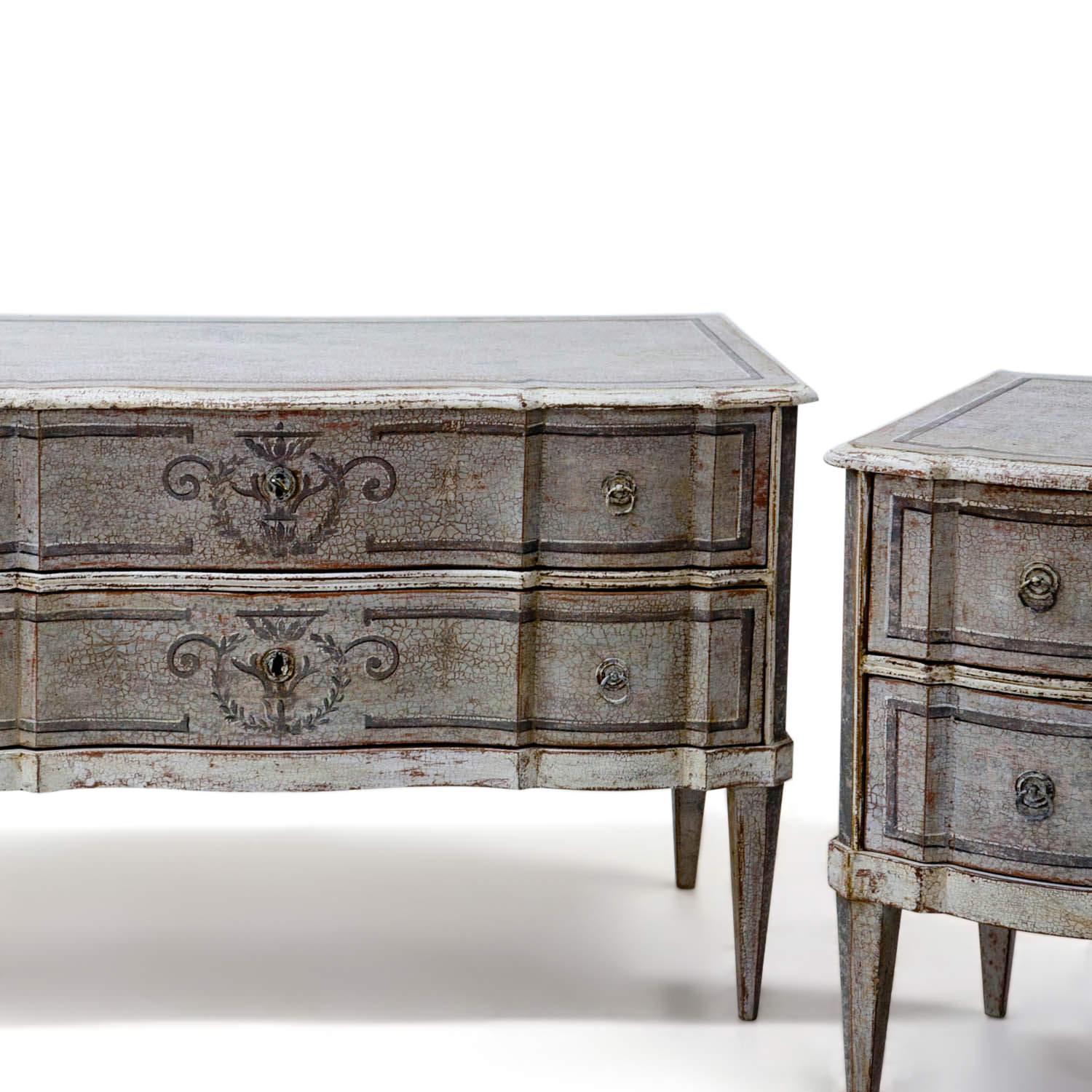 Pair of two-drawered Baroque chests of drawers with a serpentine front, standing on tall tapered feet. Very nice and large size. The grey paint is new and has a distressed look. Legs replaced.