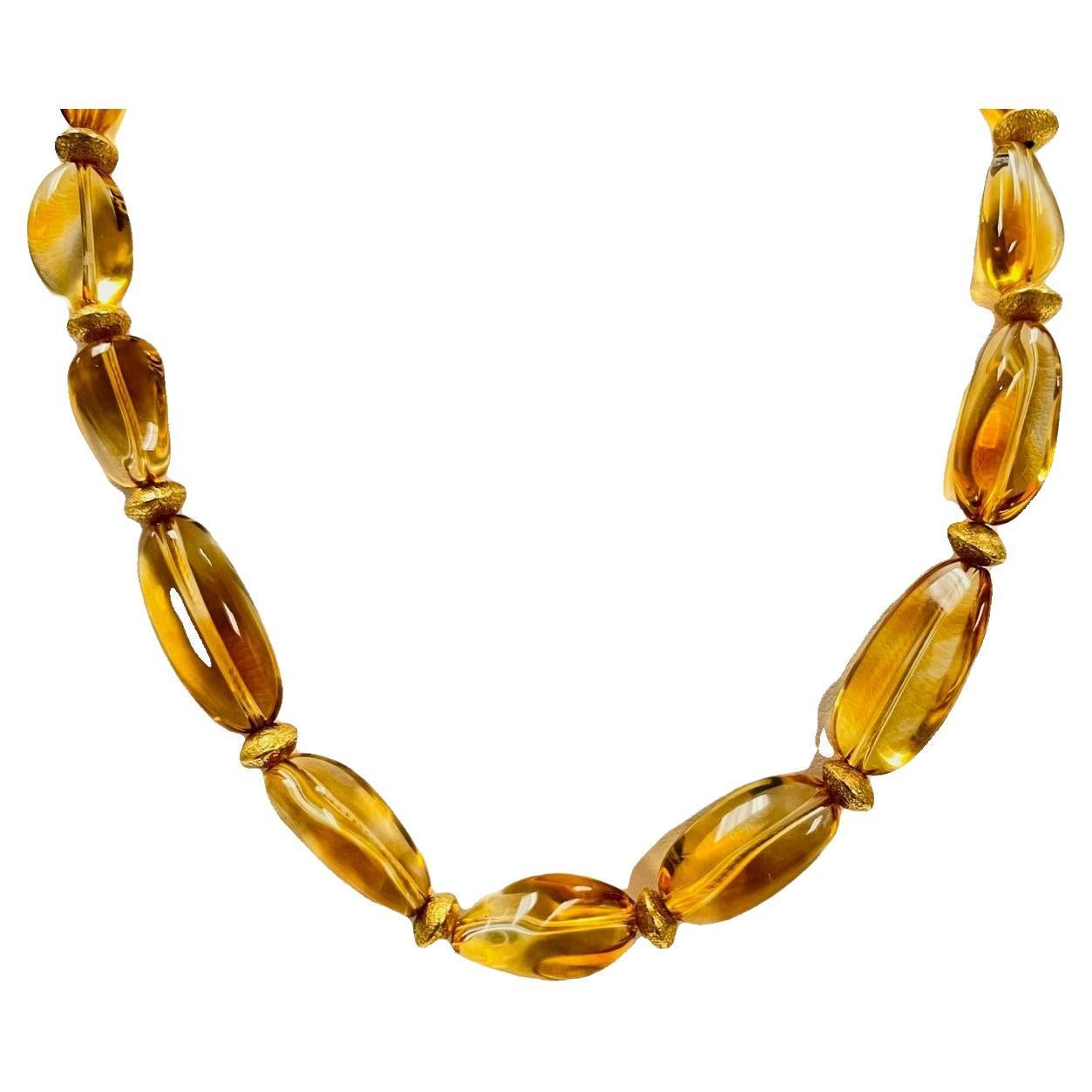 This pretty strand of  baroque citrine beads is one-of-a-kind.  It features 17 golden citrine beads in graduating sizes that display lovely warm, liquid sunshine color variations within each gemstone! The citrine has been hand strung with a liberal