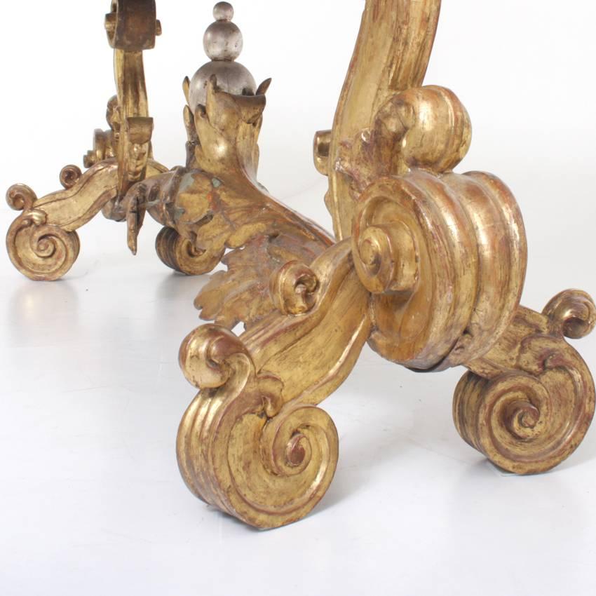 Baroque console table on a gilt volute stand with a vine-shaped strut and a central silvered spherical ornament. The green, slightly rounded tabletop is from the 19th century.