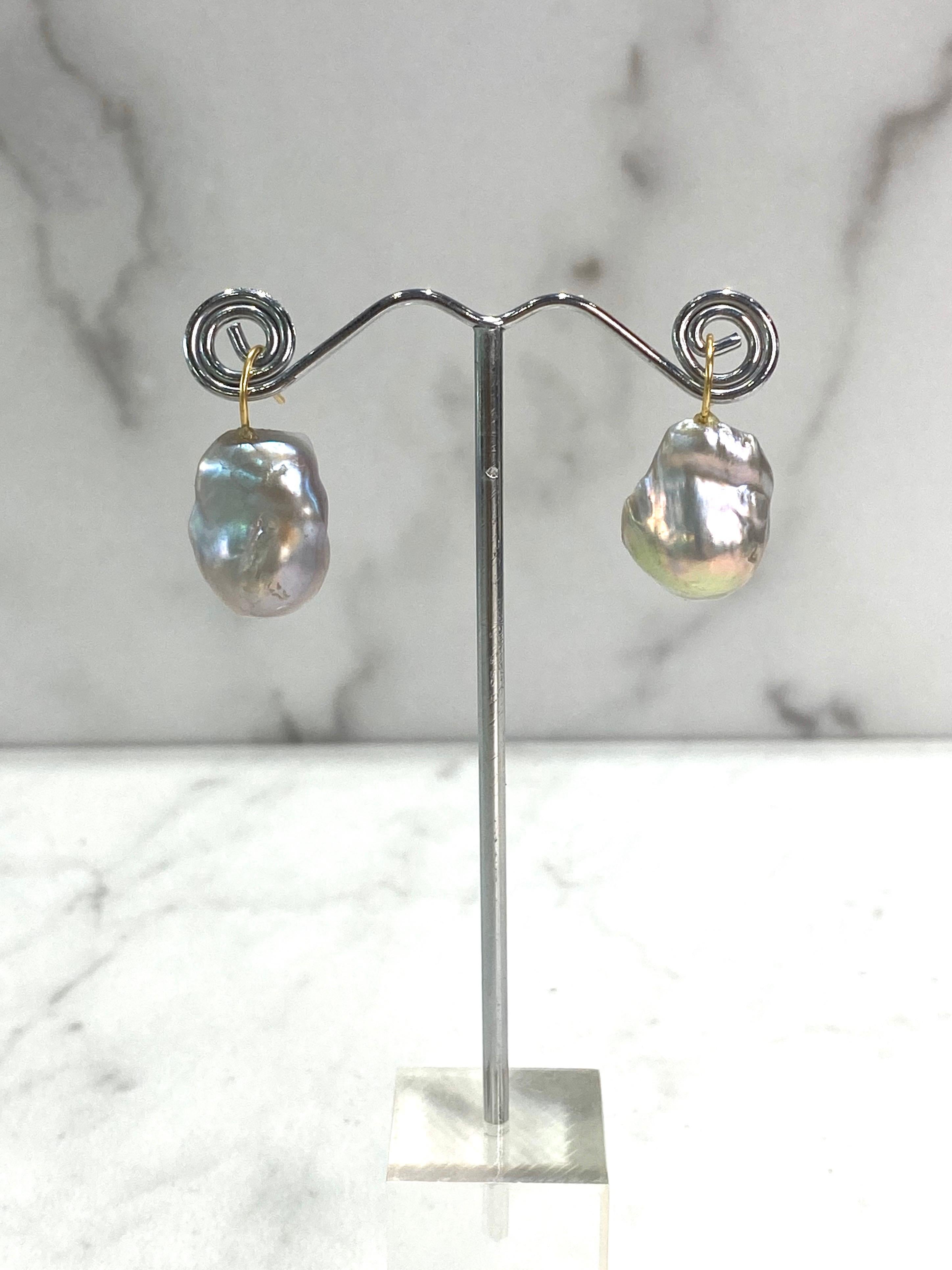 These earrings should be a staple to any wardrobe - simple, elegant yet big enough to make a statement. They are made of a beautiful shade of platinum silver, naturally colored, baroque Edison pearls, mirror-like luster, with an 18k yellow gold