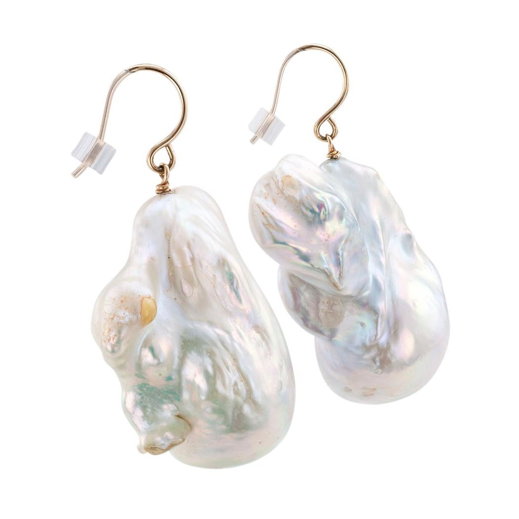 Baroque fresh water cultured pearls and yellow gold drop earrings.

DETAILS:

PEARLS:  two baroque fresh water cultured pearls measuring approximately 31 mm X 22 mm overall, white with silvery-grey color highlights.

METAL:  14-karat yellow