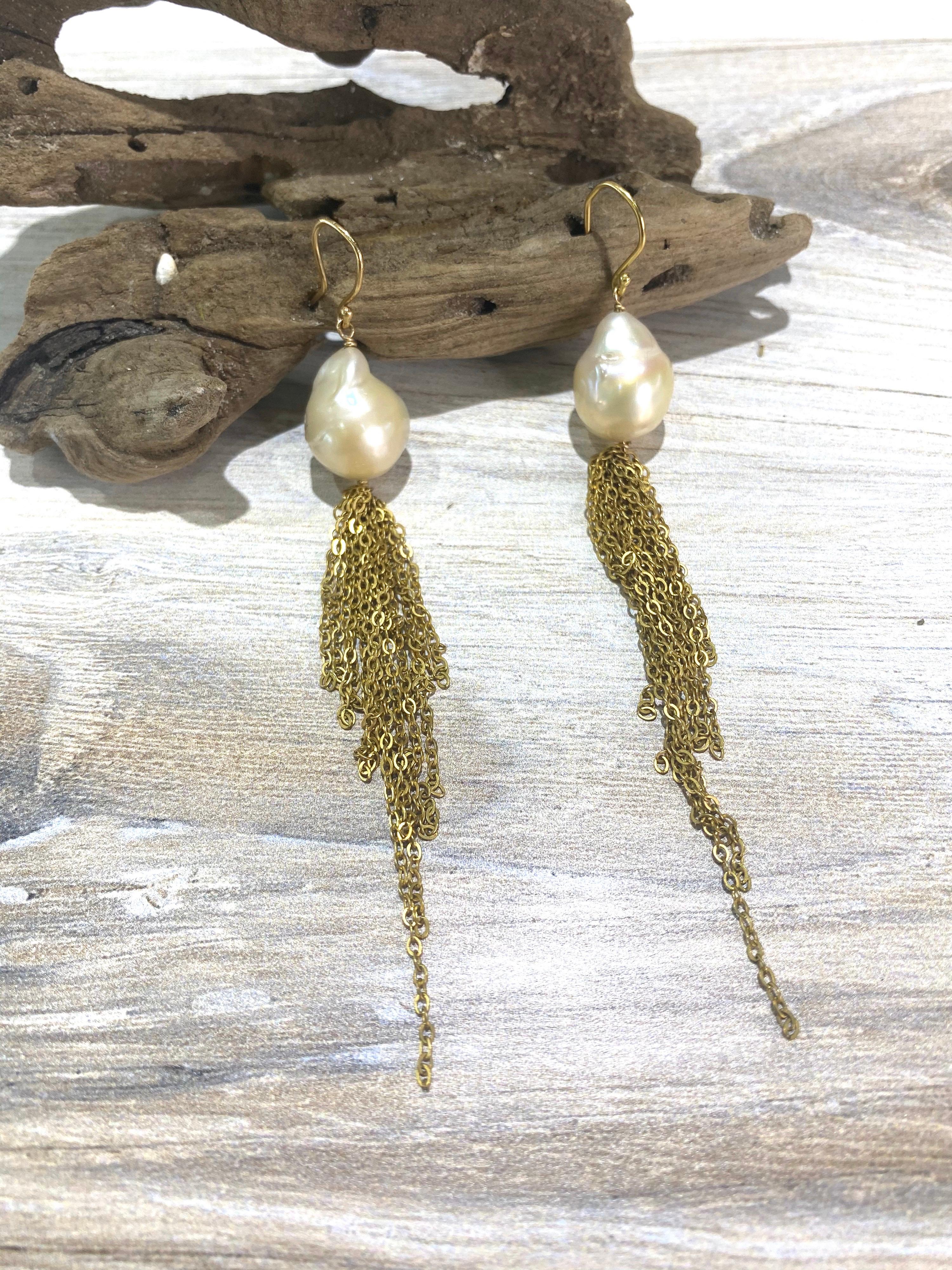 These scrumptious earrings earrings are made of baroque, naturally colored champagne, 12mm in size, excellent luster with an 18k yellow gold hook.  Tassels are made of shimmering strands of 14k GF chain.  Earrings are 4