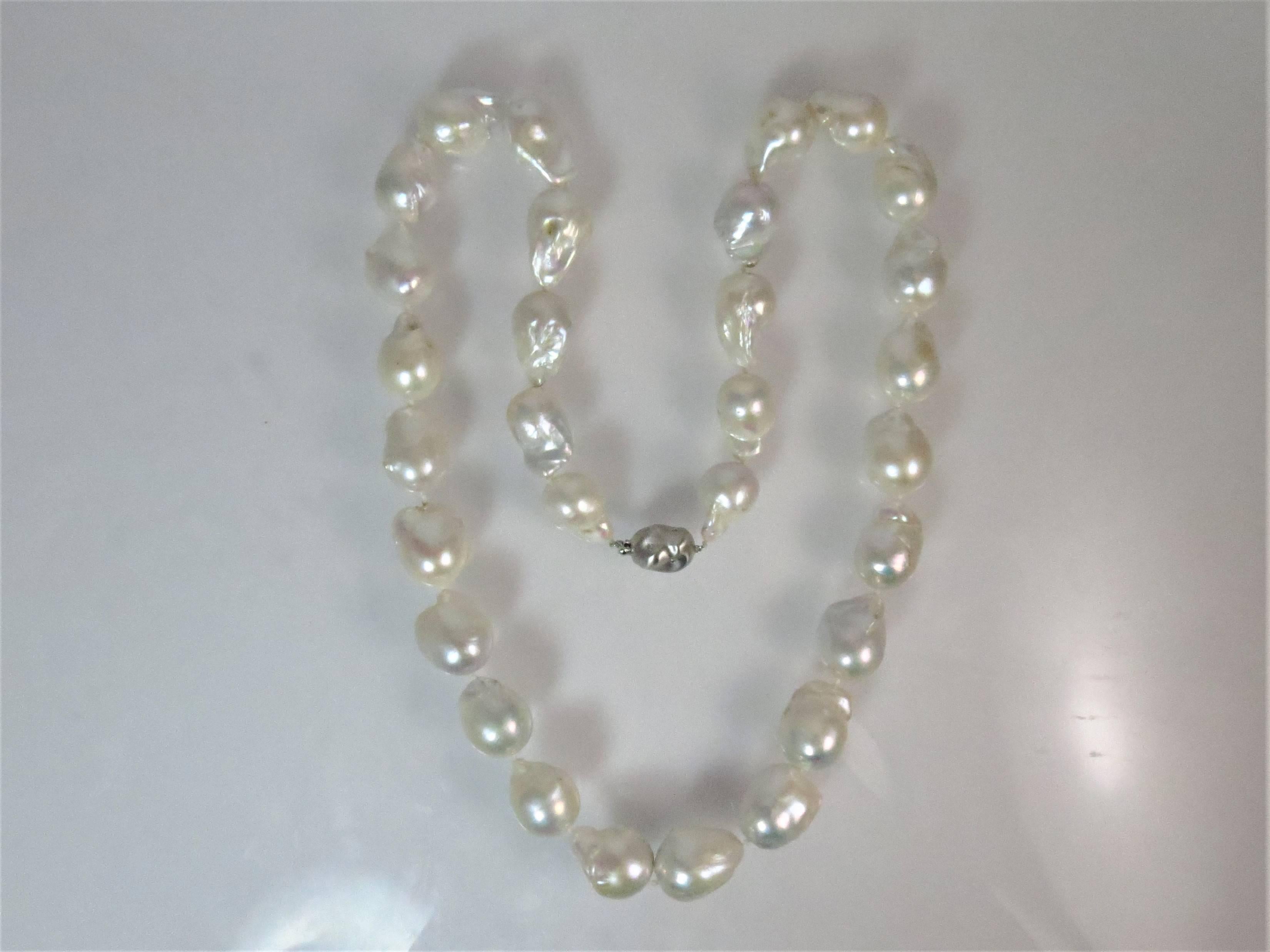 Baroque Freshwater South Sea pearl necklace with 30 Baroque South Sea pearls, 18.8mmx16mm with 14K white gold diamond clasp with 8 single cut, flush set diamonds weighing about .08cts,  HI color, VS clarity. 28 inches long.