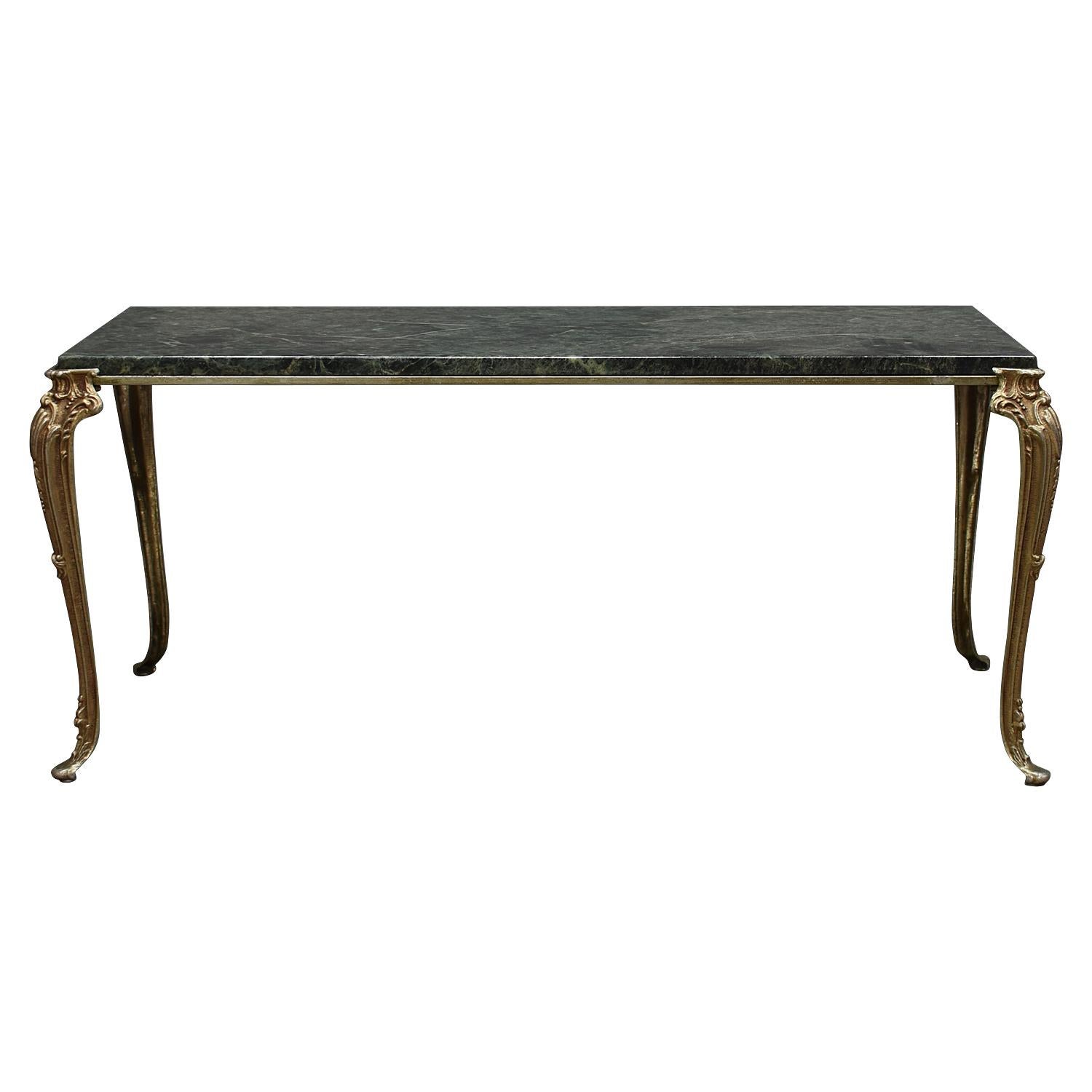 Great-Gatsby baroque coffee table with gorgeous green marble top and brass base.

Designer: Unknown

Manufacturer: Unknown

Country: France or Italy

Model: Coffee table

Material: Marble / brass

Size in cm: 105 x 51 x 45