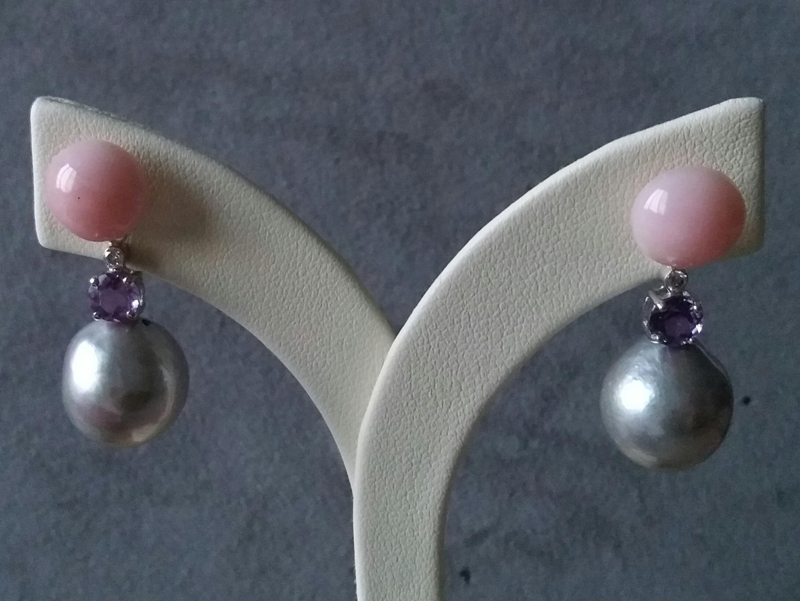 The tops are 2 round 10 mm diameter pink opal buttons,middle parts have 2 small full cut diamonds and 2 round cut amethysts, the bottom parts there are 2 baroque grey pearls about 13 mm in diameter
Total Dimensions
Length 31 mm
Width 13 mm
Weight  8